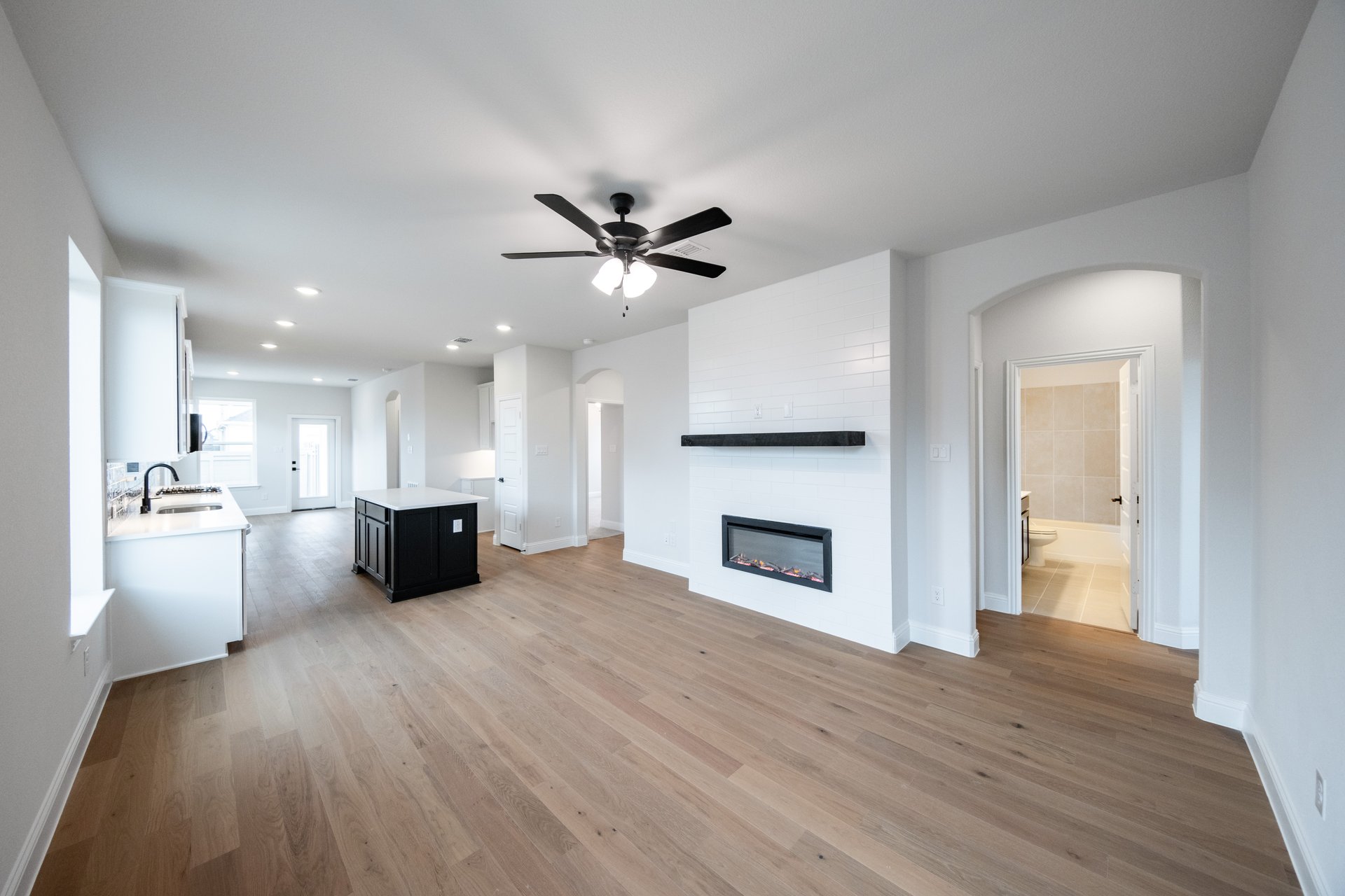 great room with wood flooring and windows