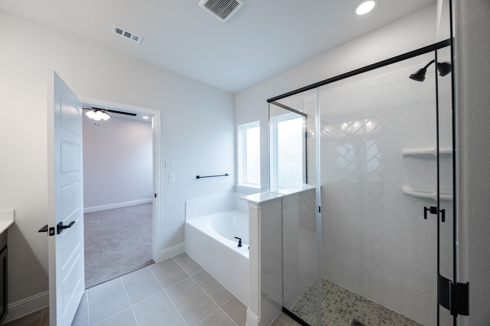 bathroom with walk-in shower and tub 