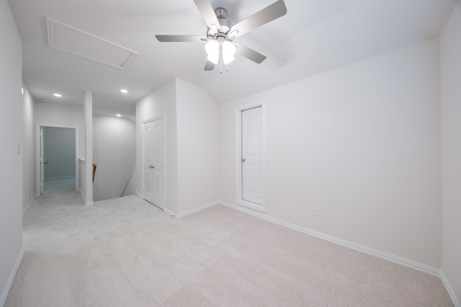 open gameroom with carpet and ceiling fan