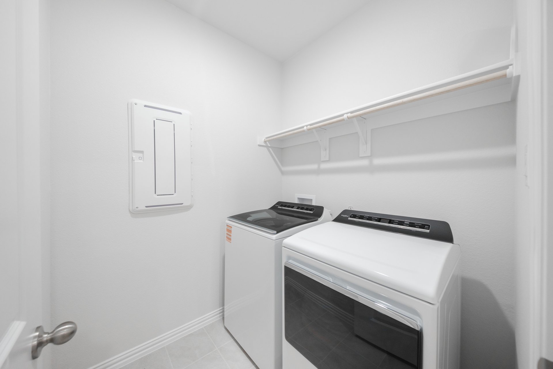laundry room with tile floors, washer, and dryer