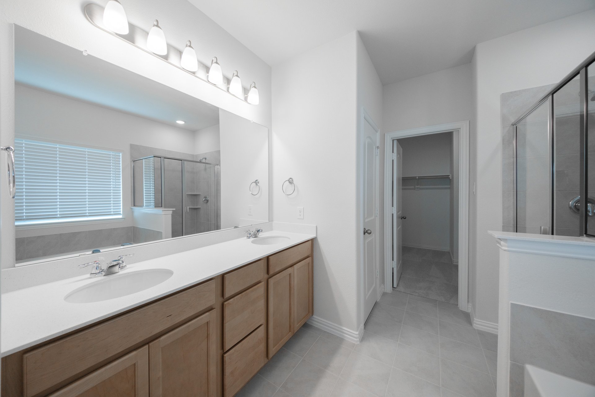 primary bathroom with soaking tub and walk-in shower