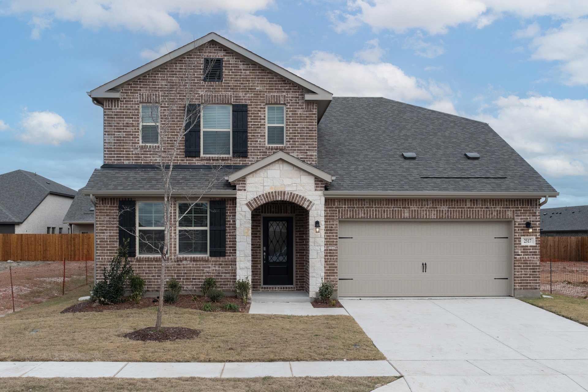 home exterior with brick and stone
