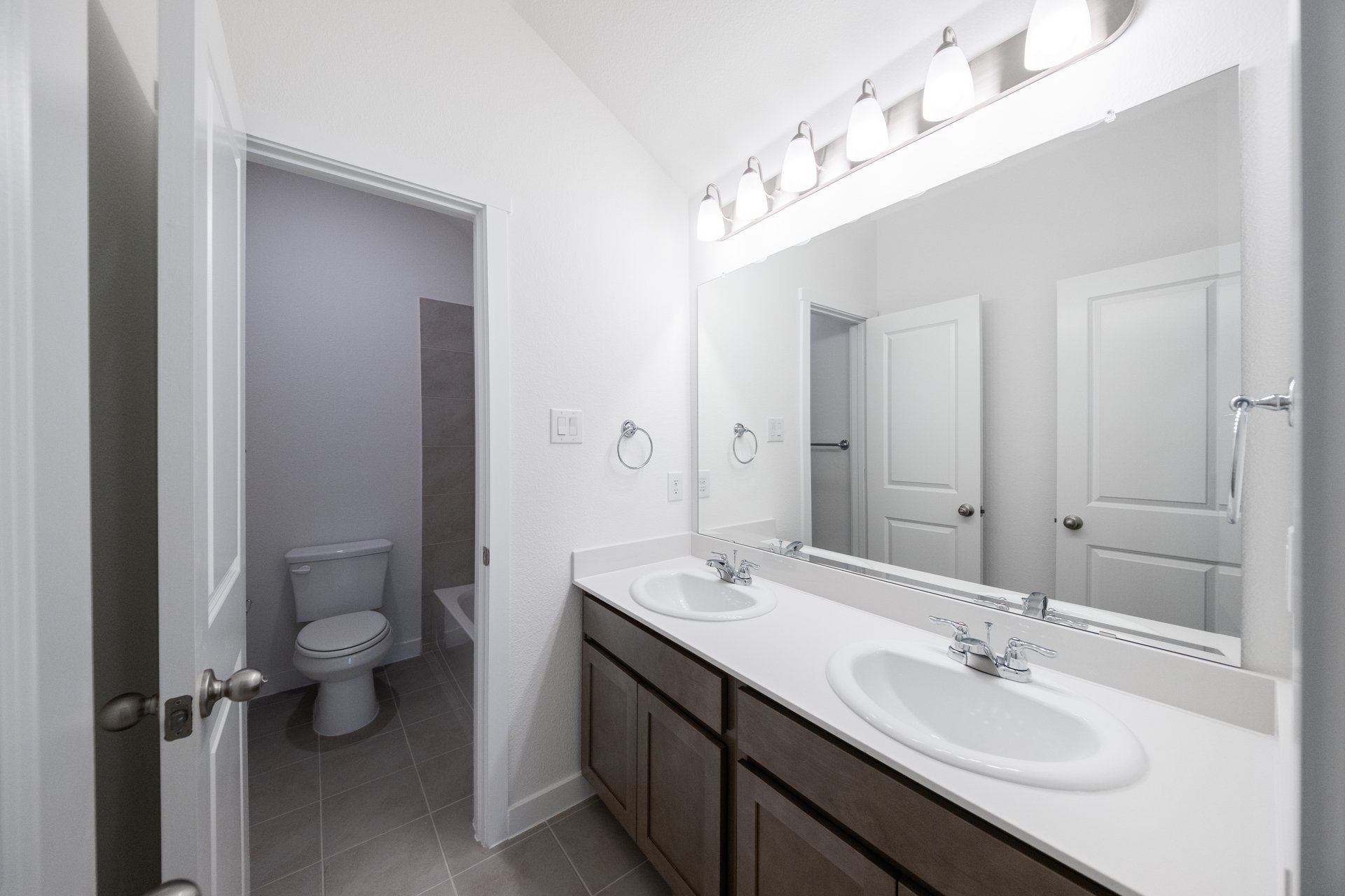 bathroom with two sinks and white countertops