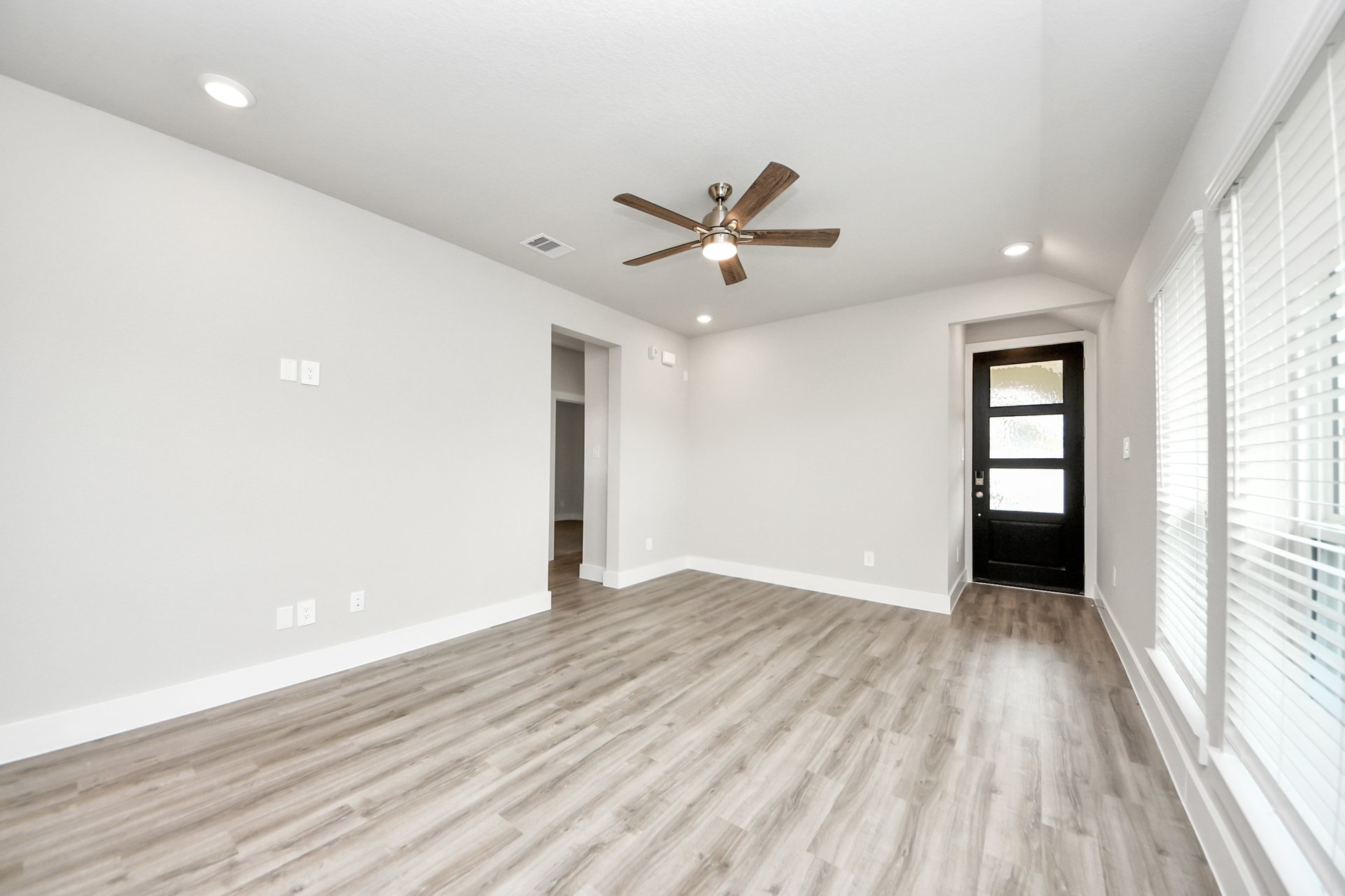 Great room with wood-like flooring