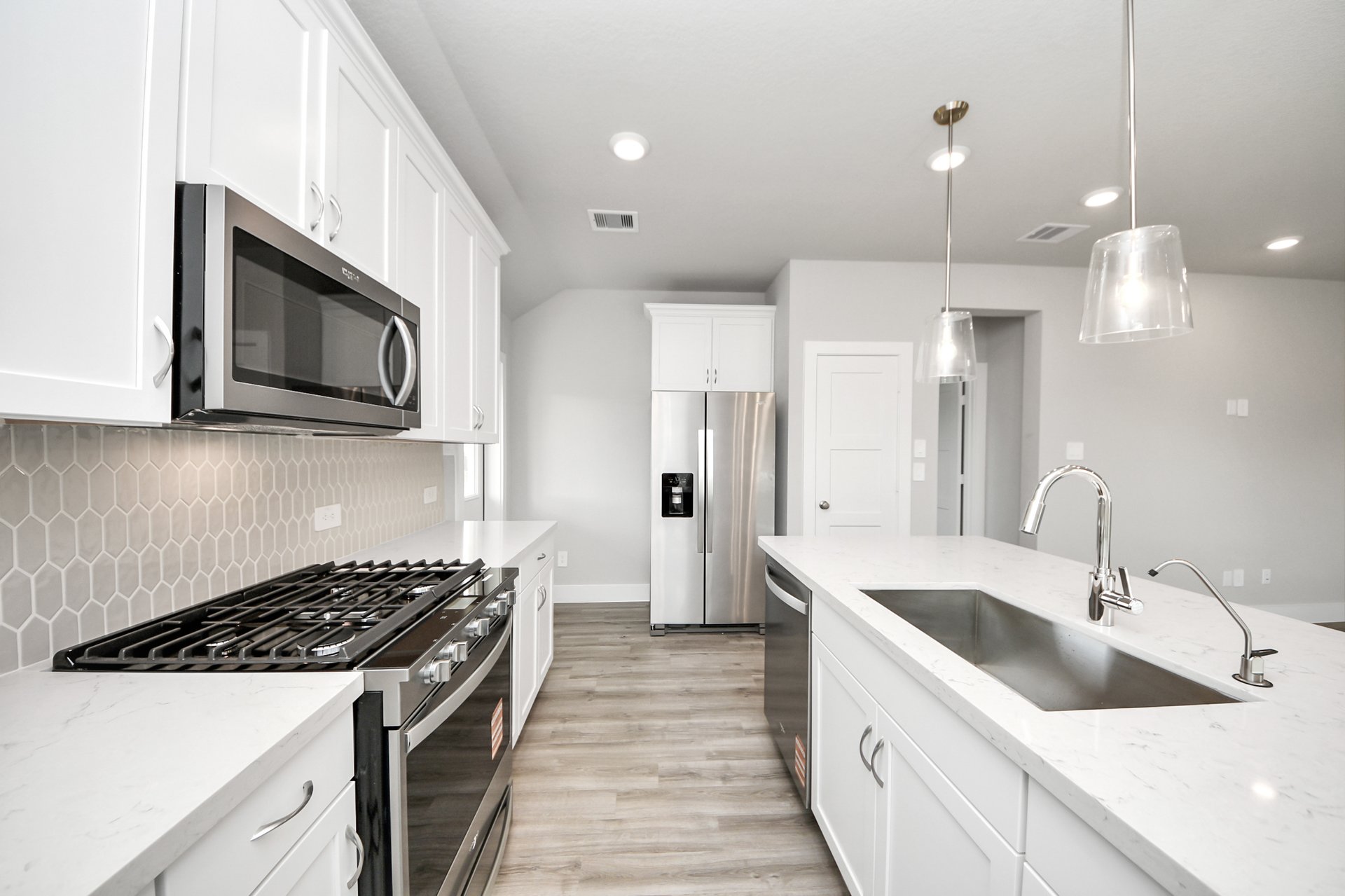 Kitchen with white cabinets.