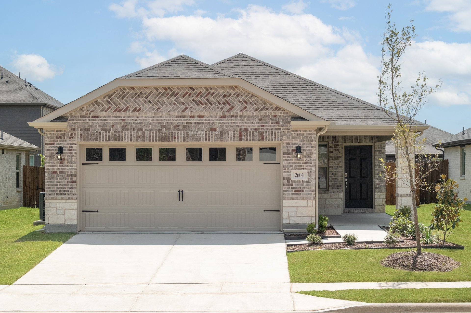 one-story with brick and stone exterior