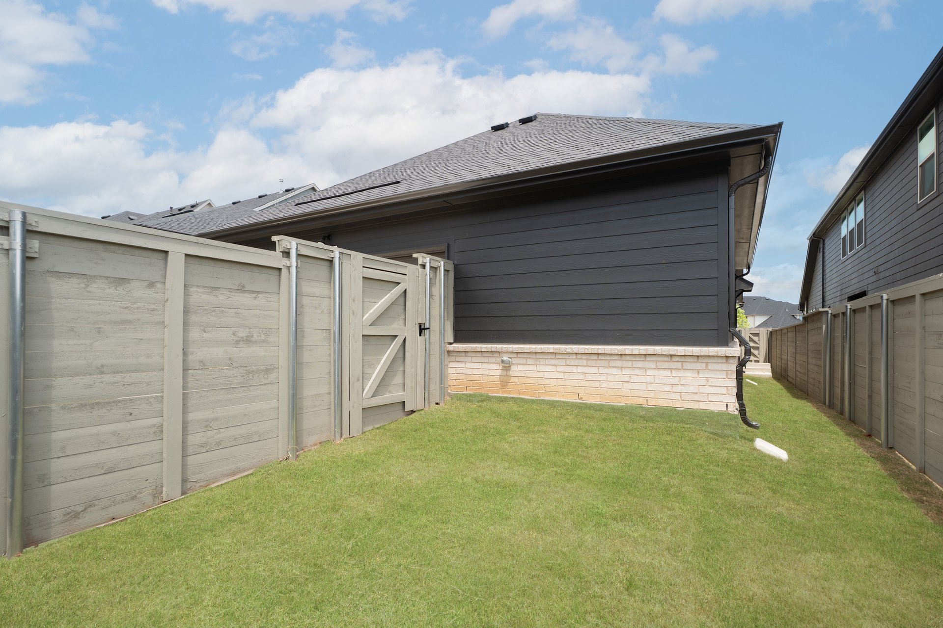 backyard with grass and covered patio