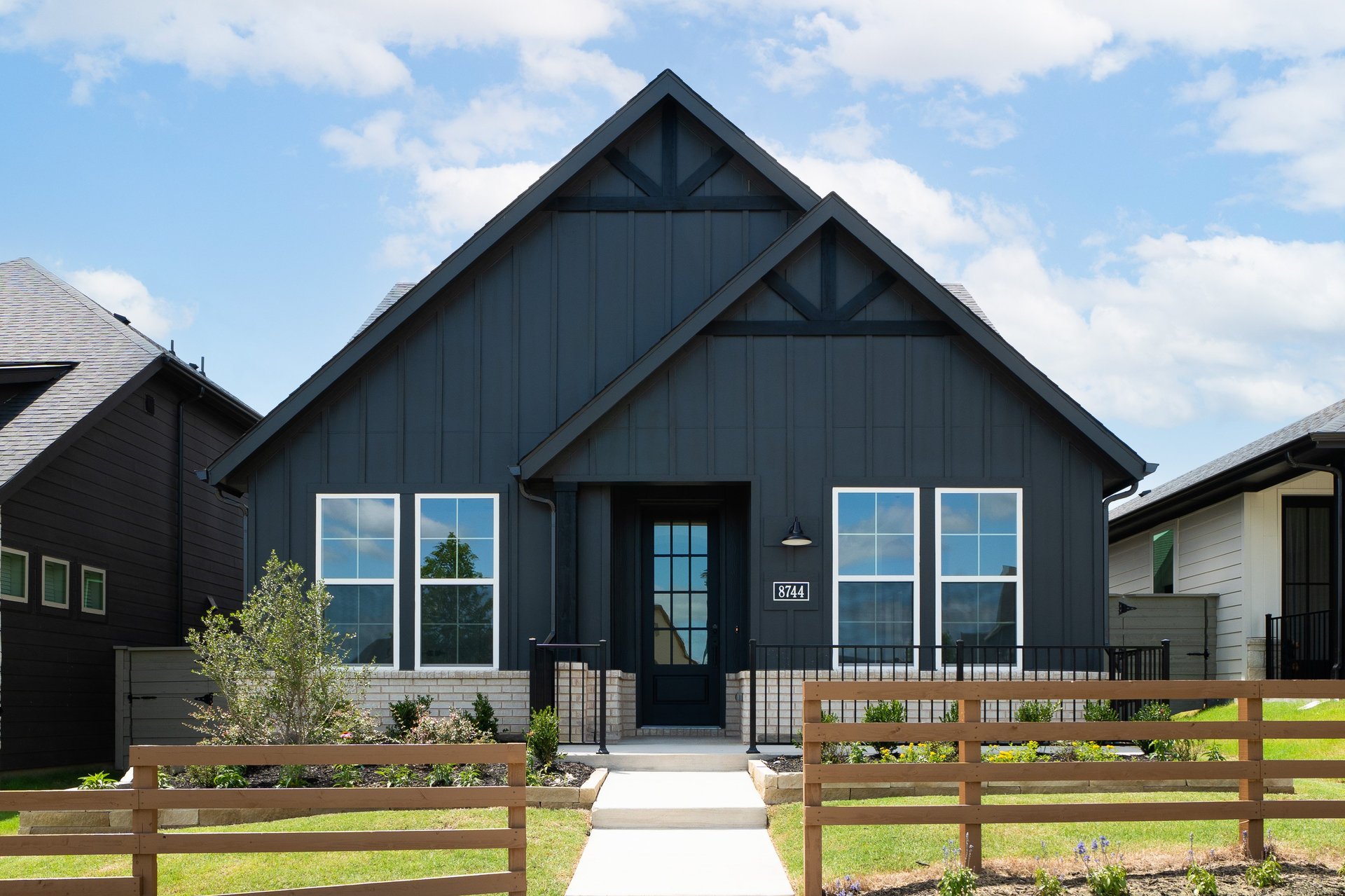 one-story with brick and wood exterior