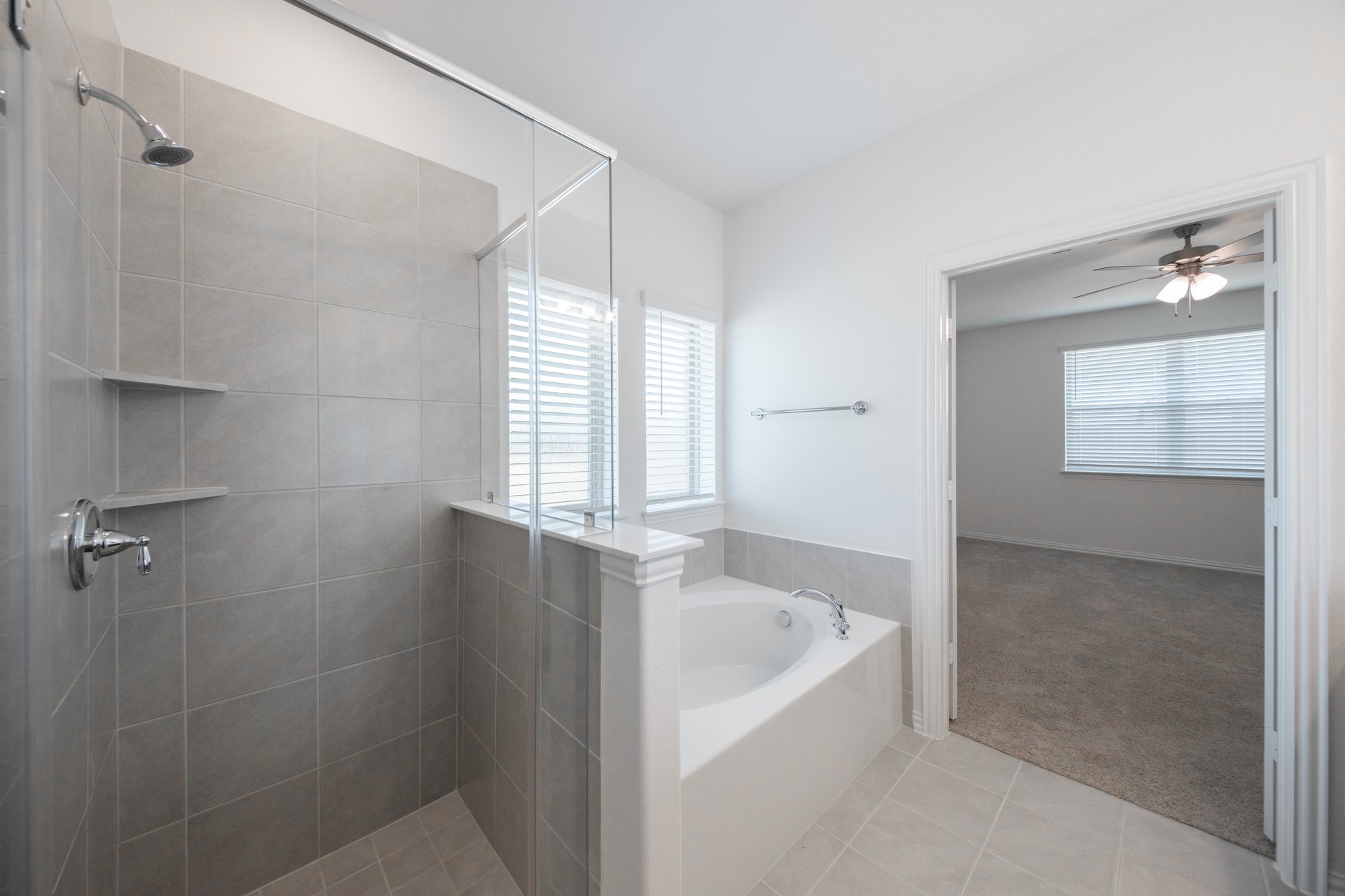primary bathroom with soaking tub and walk-in shower