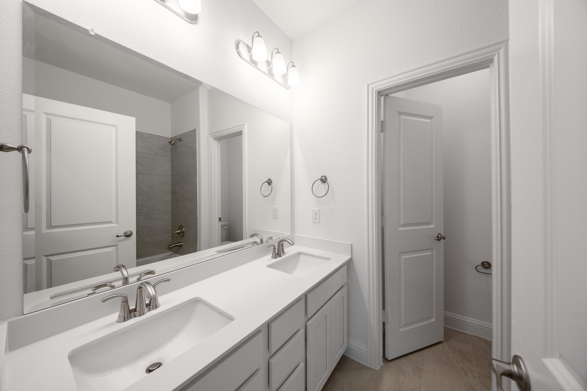 bathroom with two sinks and white countertops 