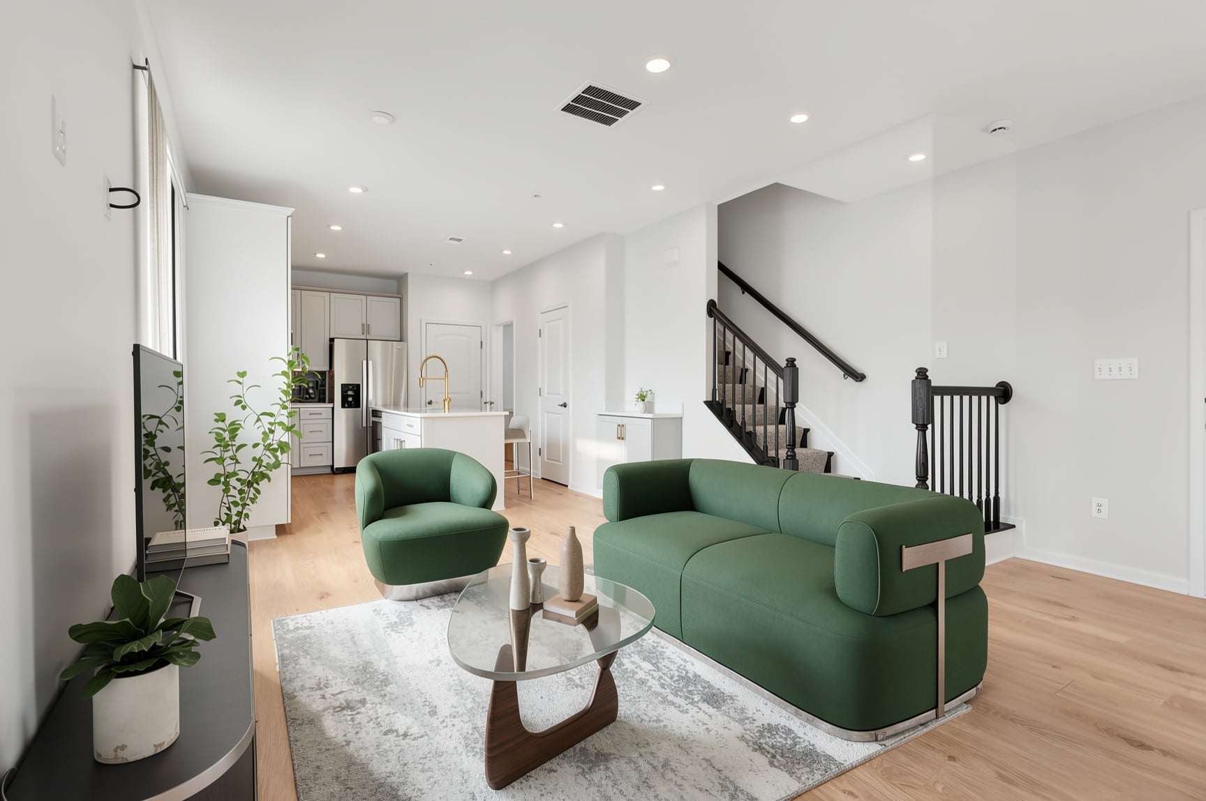 great room with two green couches