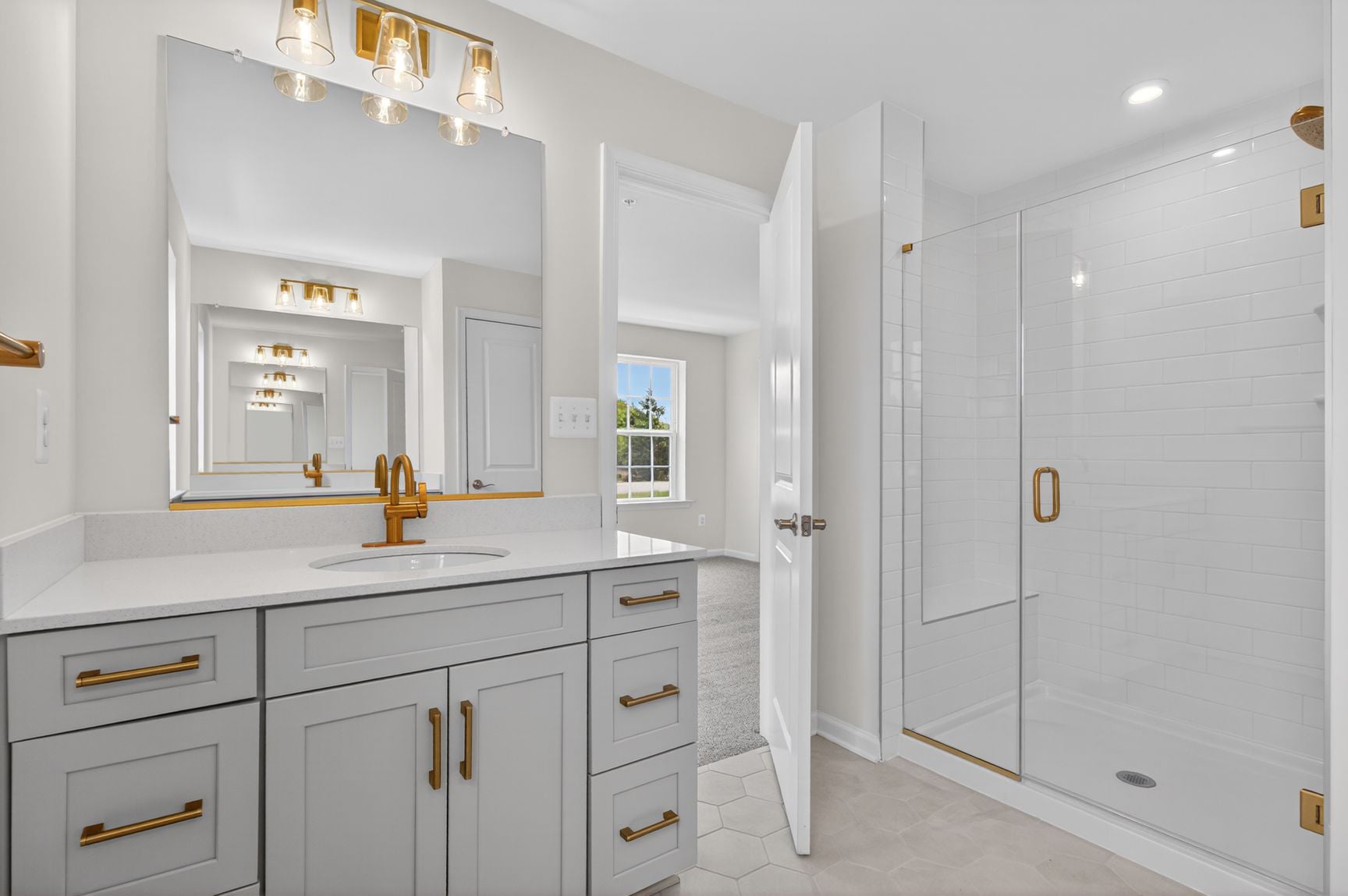 primary bath with a large walk-in closet