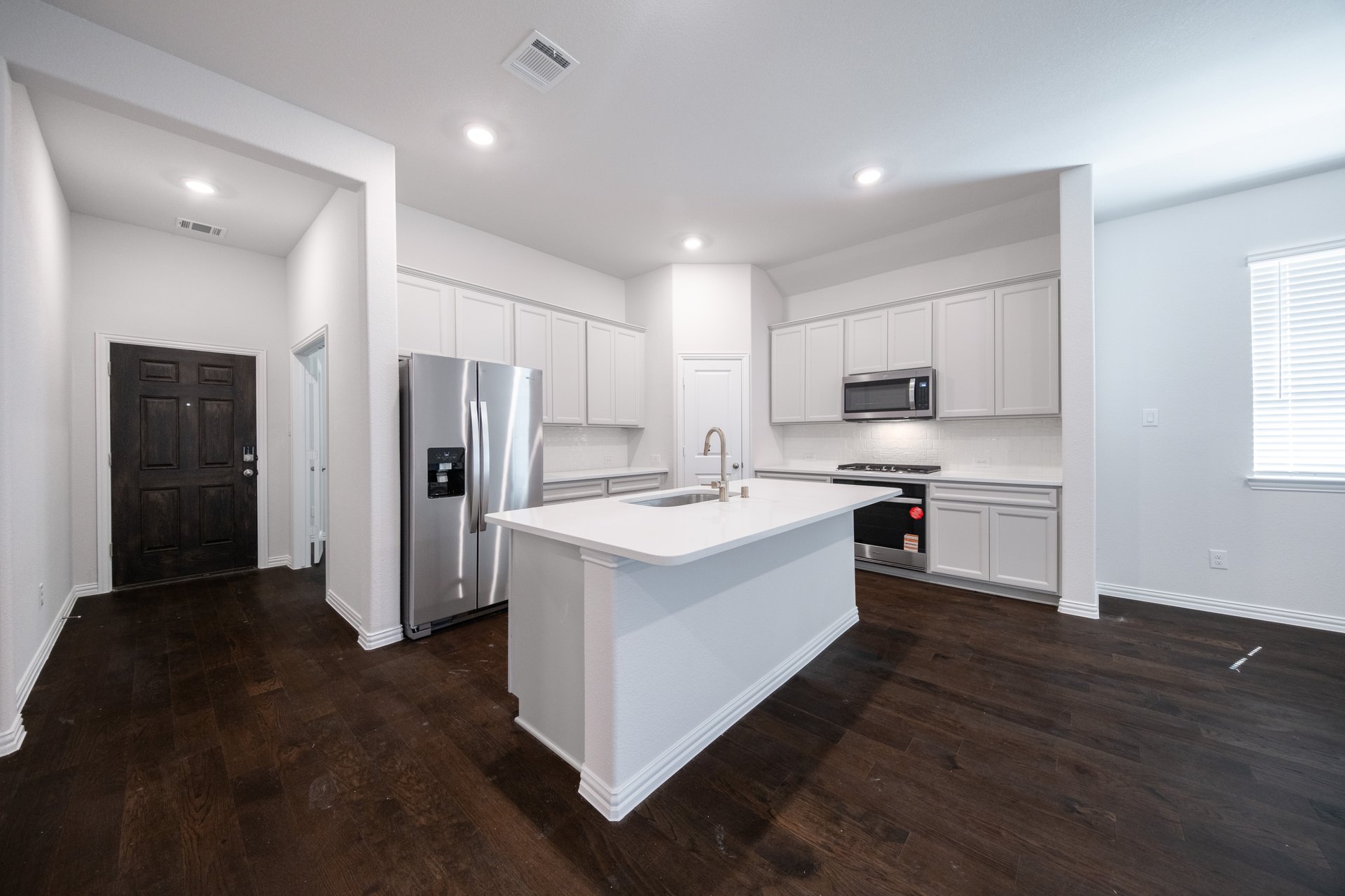 open kitchen with light gray cabinets