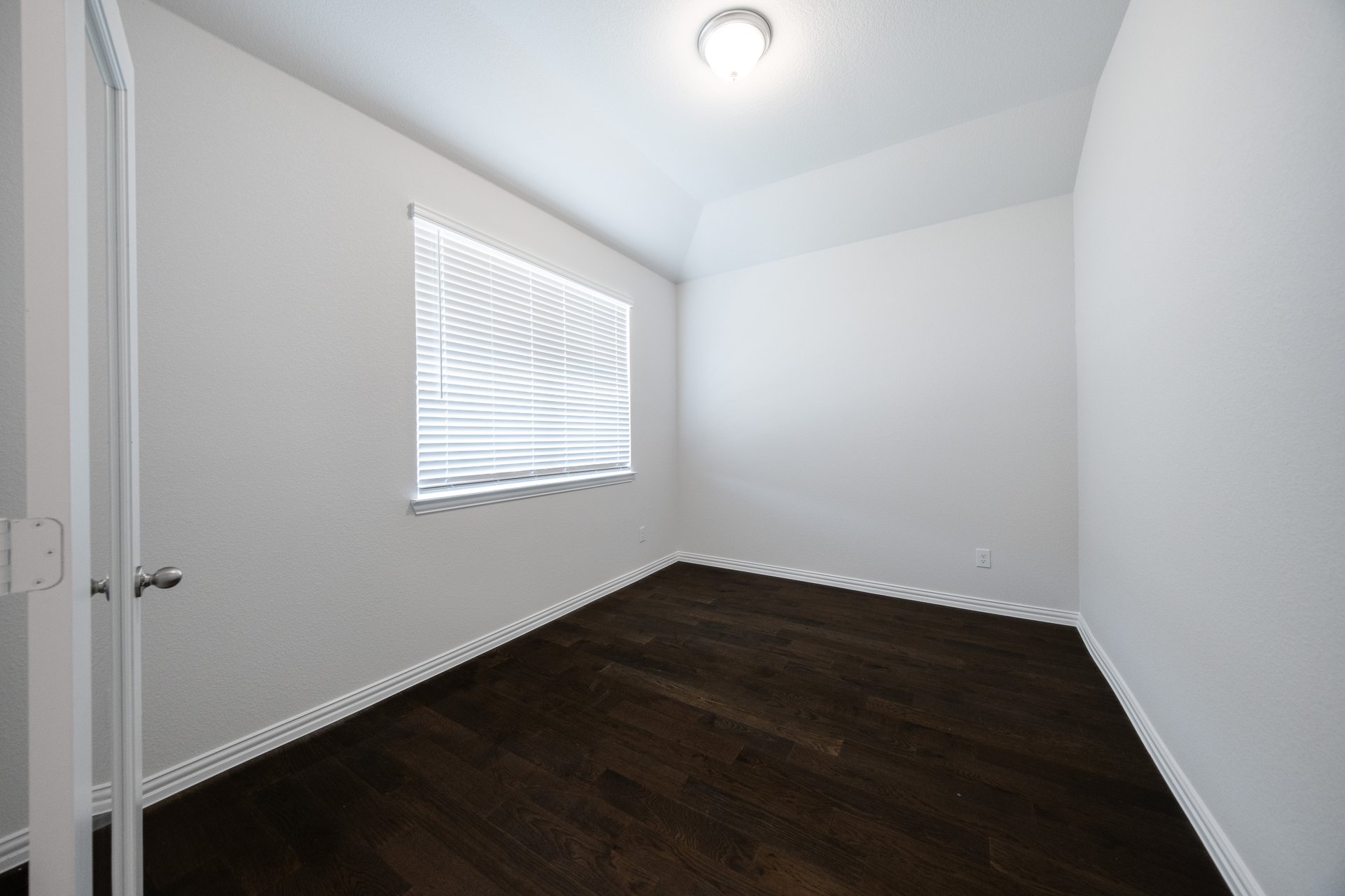 spacious study with hardwood flooring