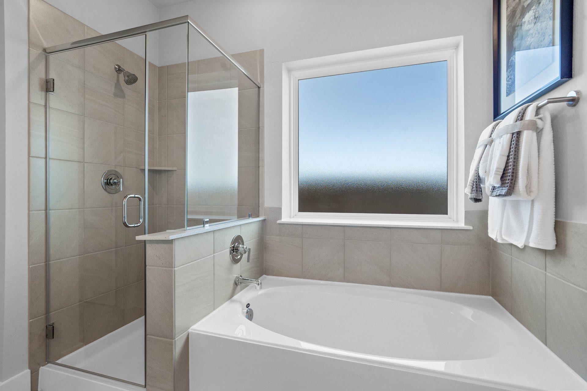 primary bathroom with soaking tub and walk-in shower