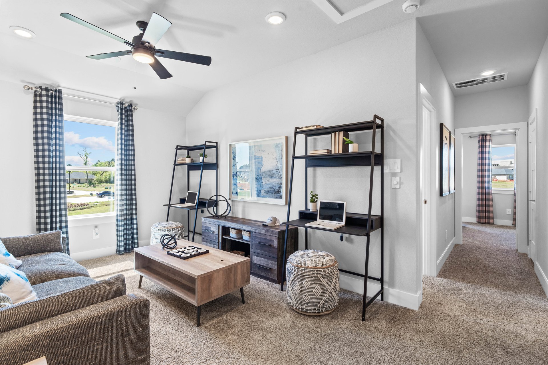 open loft with carpet and windows