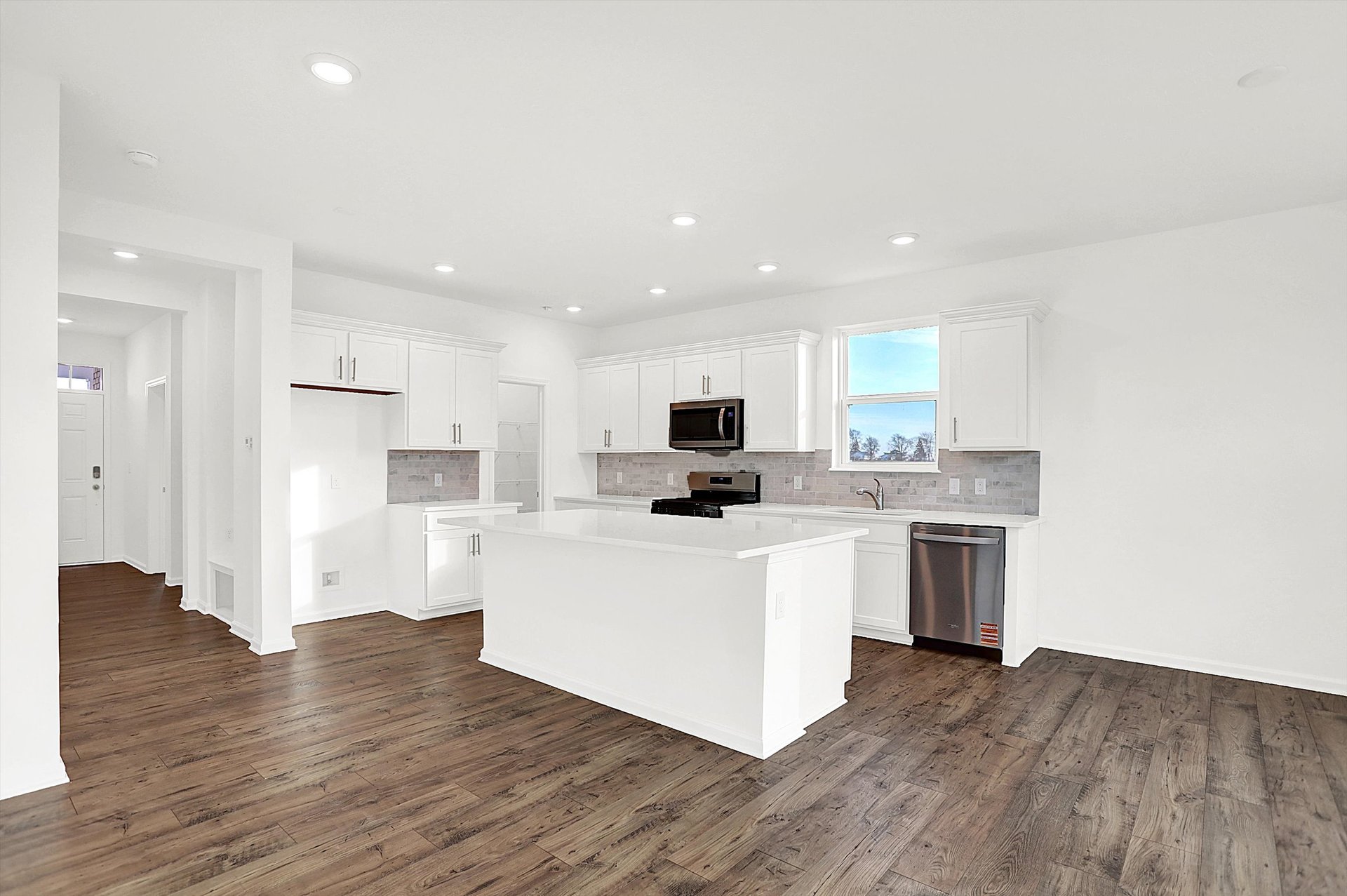 kitchen with white cabinets and tile backsplash