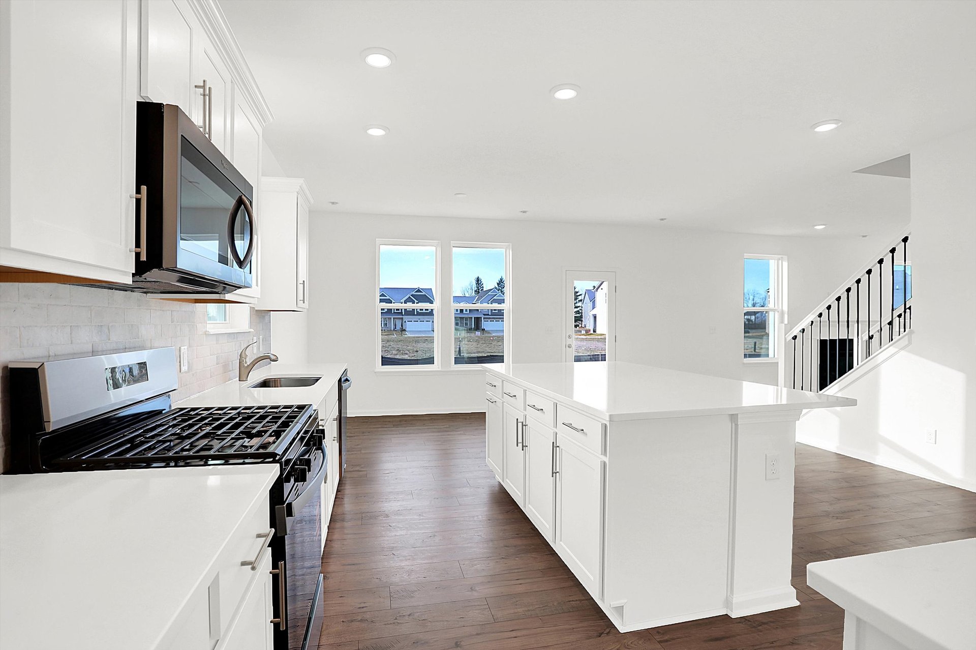 kitchen with white cabinets and tile backsplash