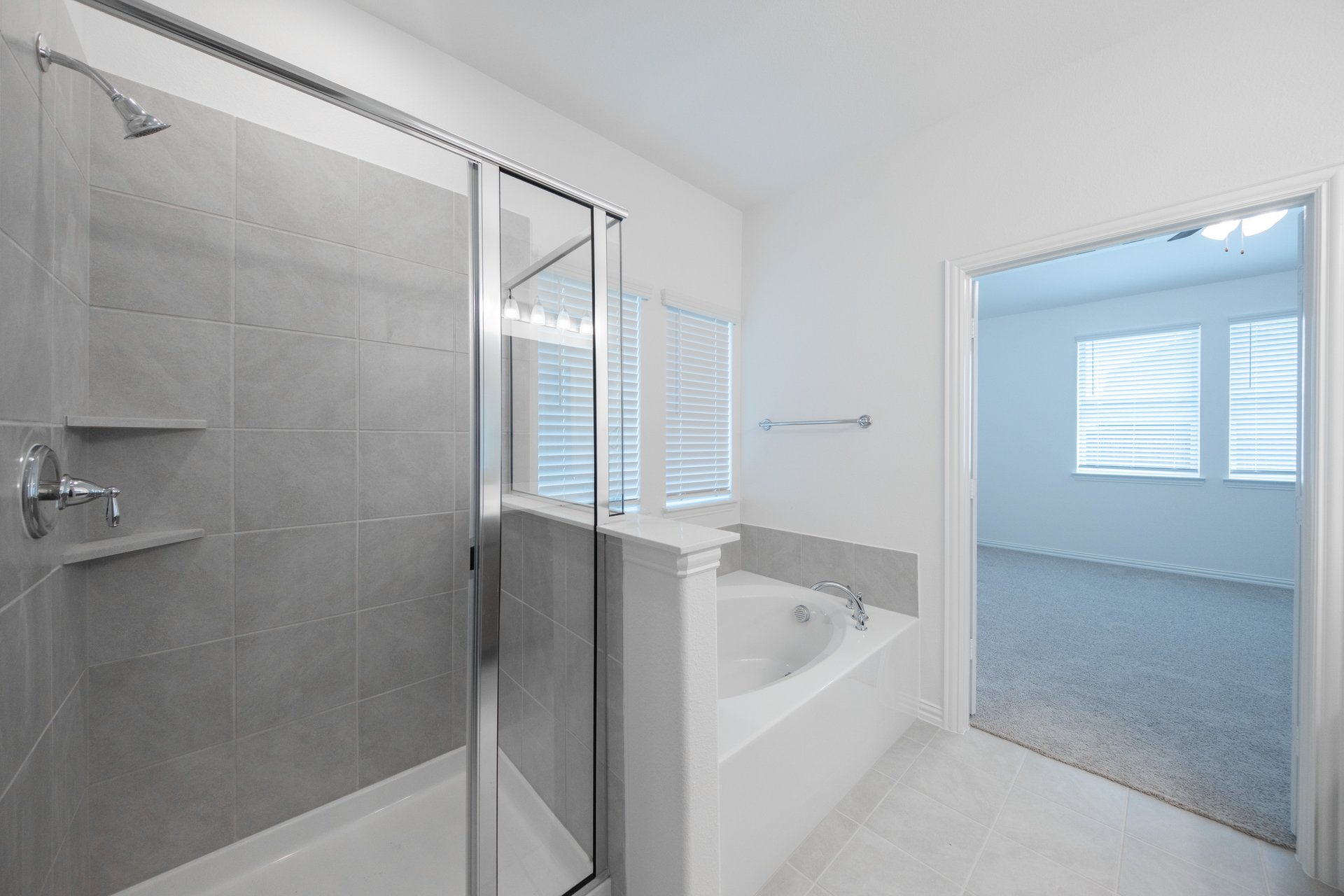 primary bathroom with soaking tub and walk-in shower