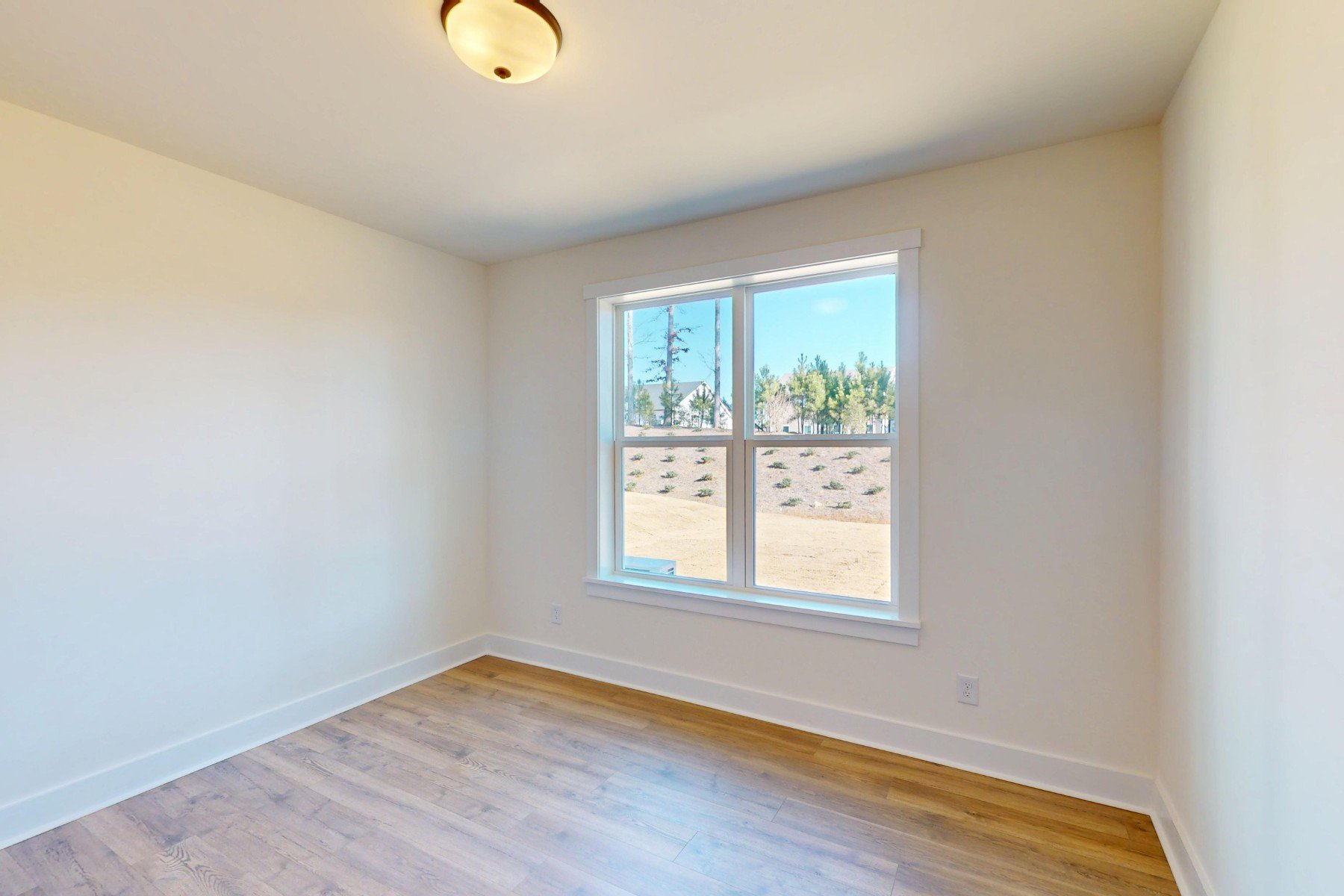 bedroom with a light and window
