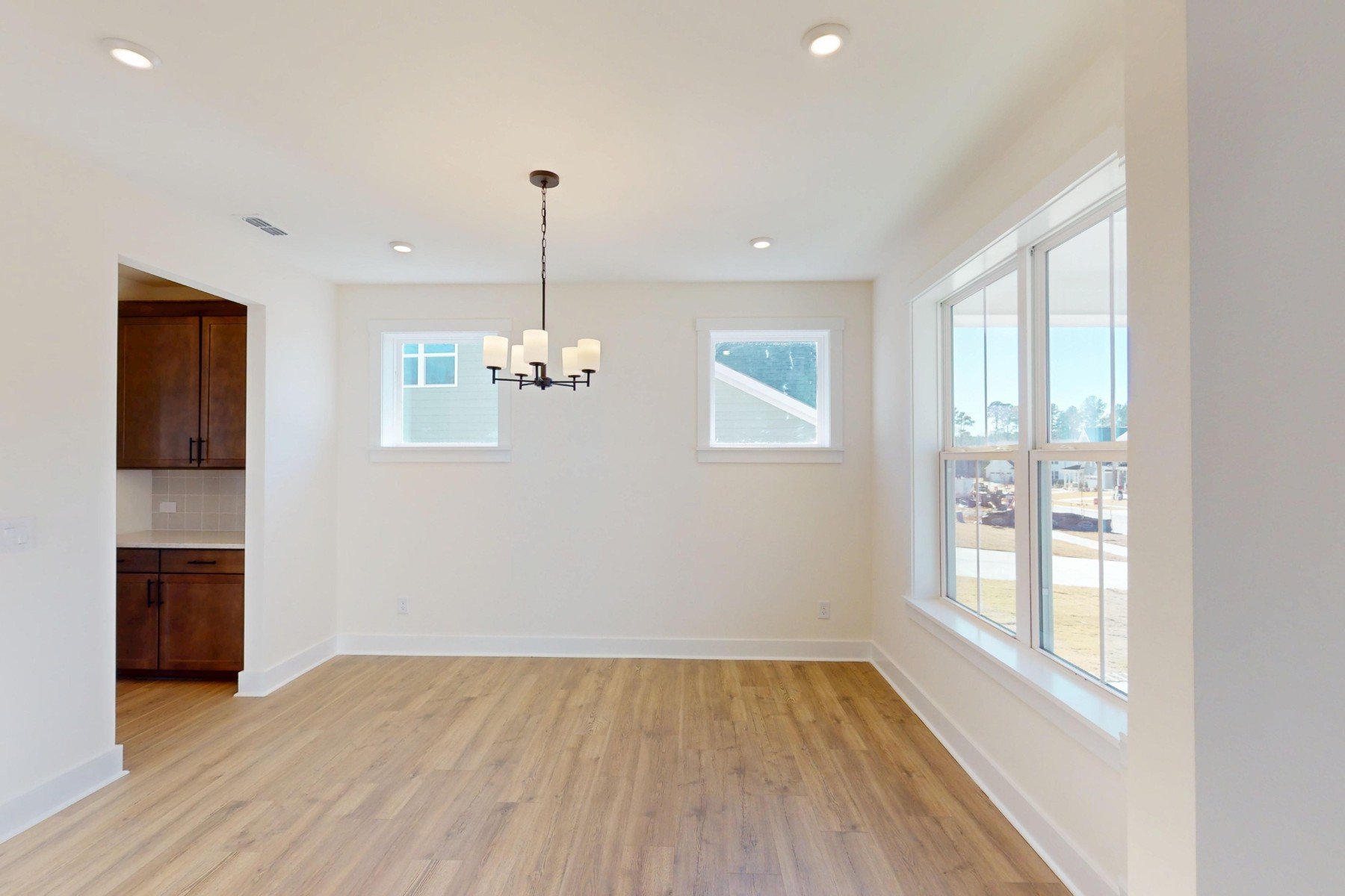 dining room with lighting and windows