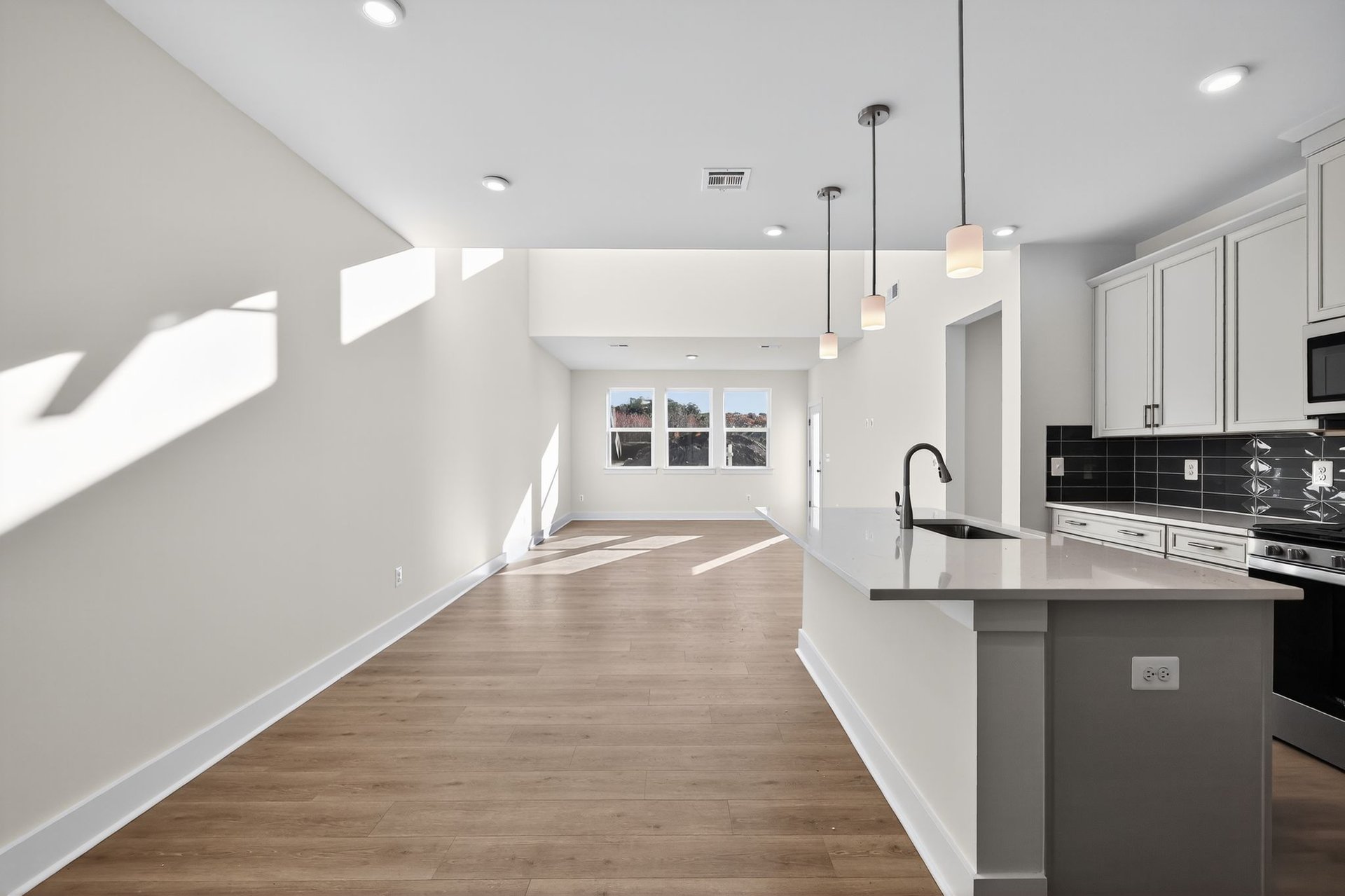 dining area connected to the kitchen with designer flooring