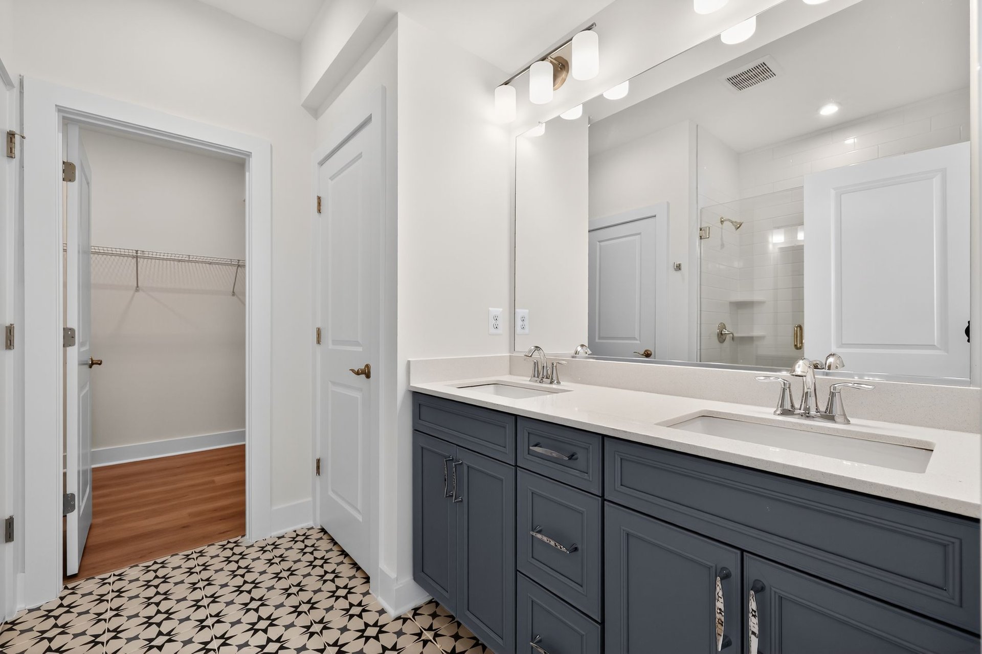 primary bath with statement tile floors