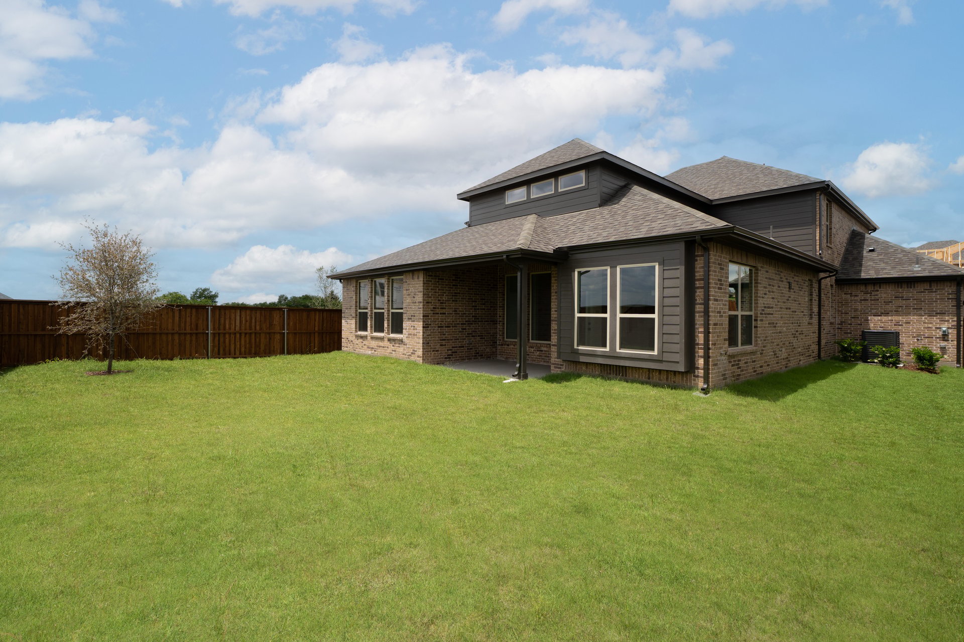 backyard with grass and covered patio