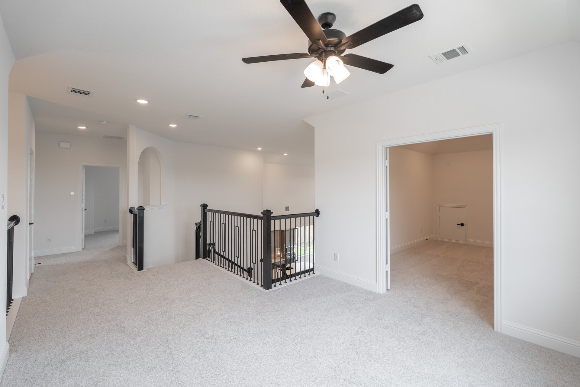 open gameroom with carpet and ceiling fan
