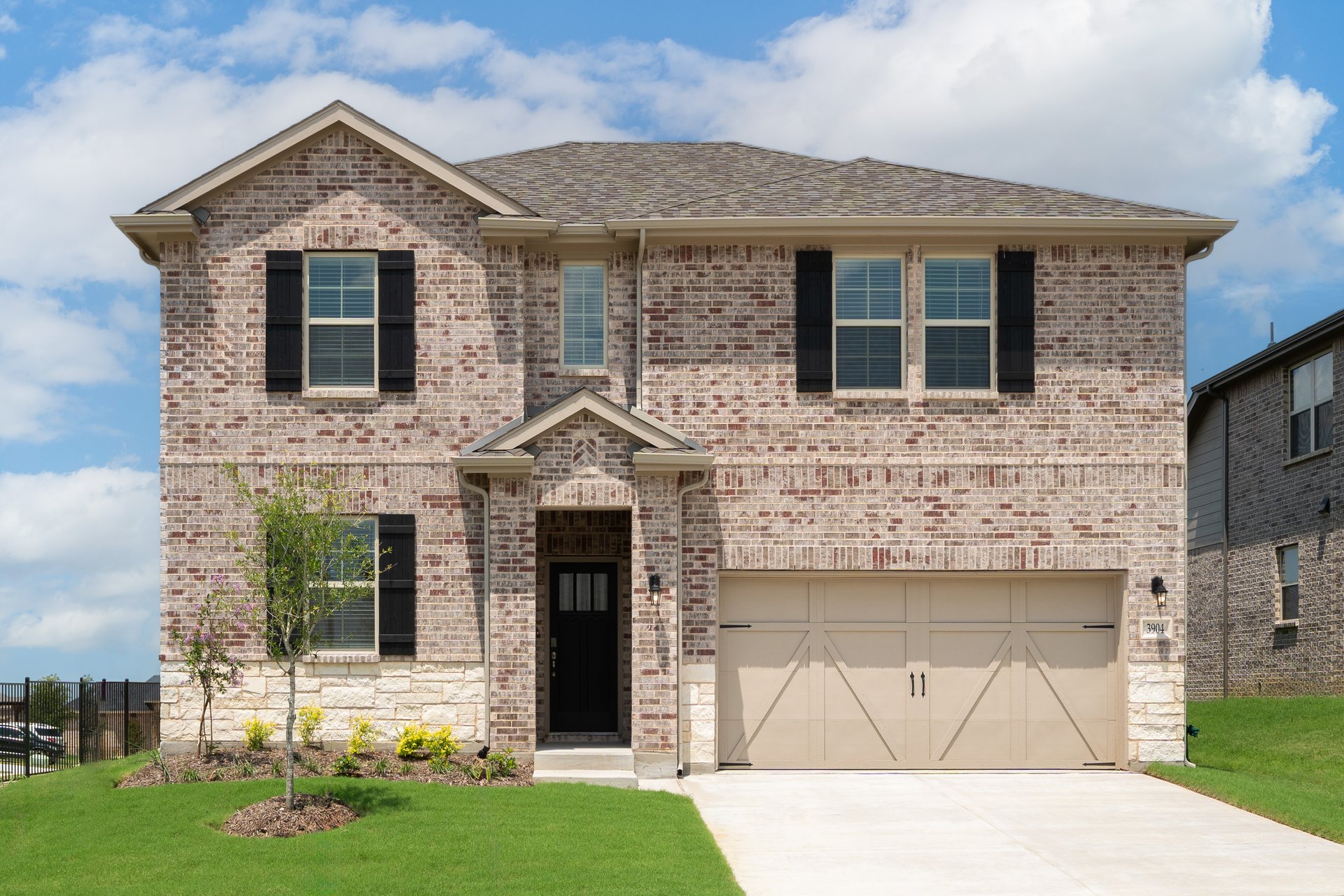 two-story home with brick and stone exterior
