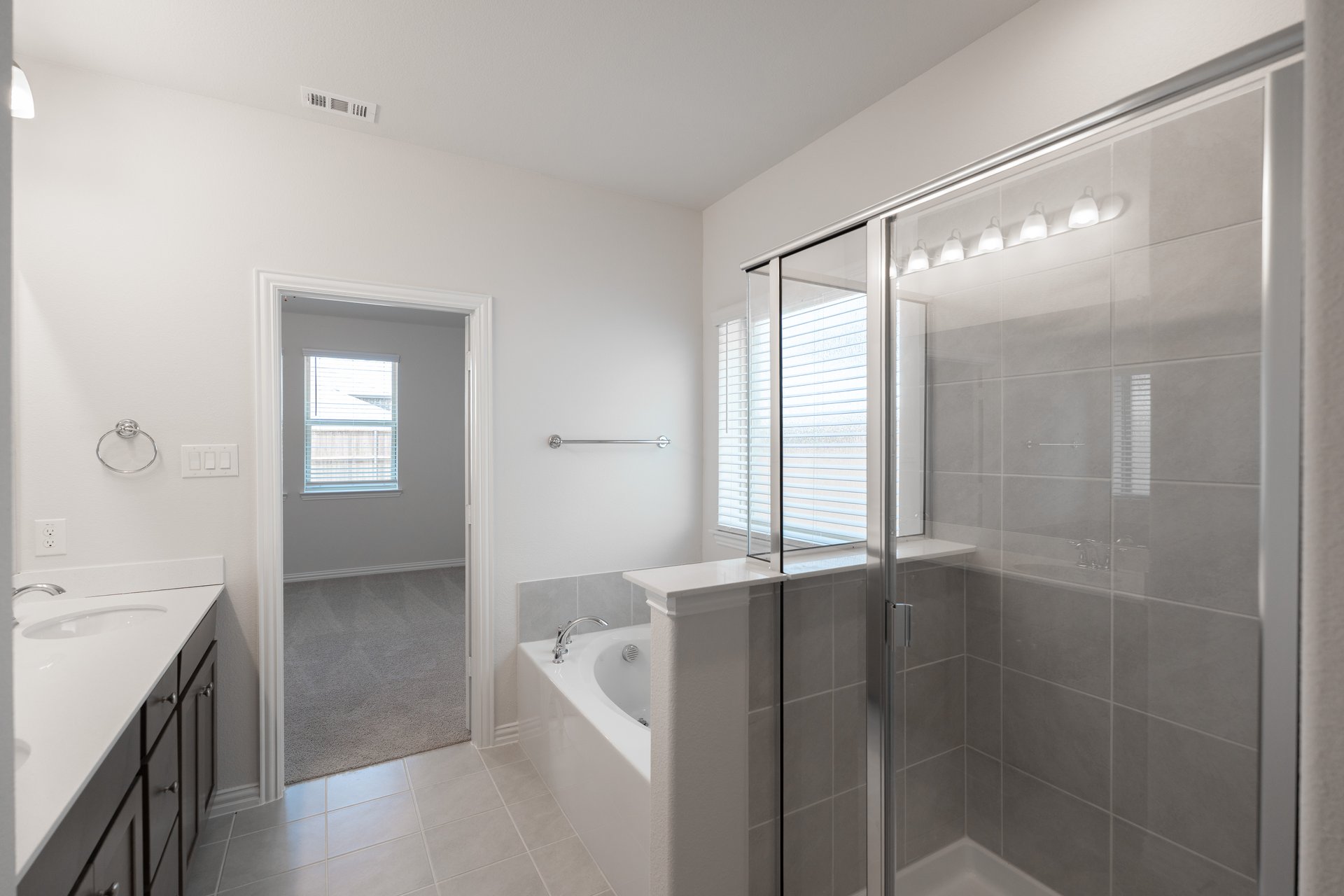 primary bathroom with soaking tub and walk-in shower