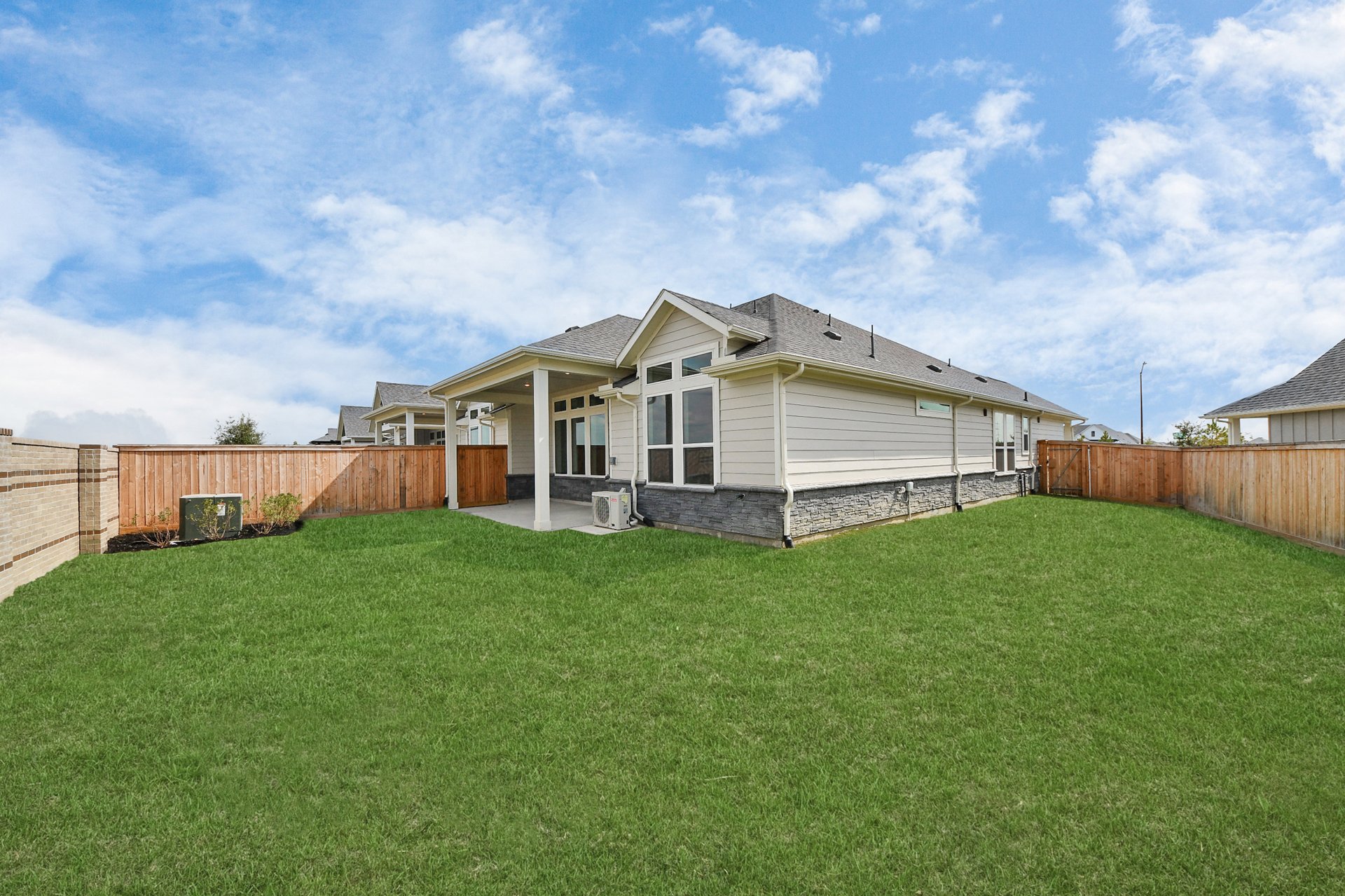 large backyard with full sod and covered back patio