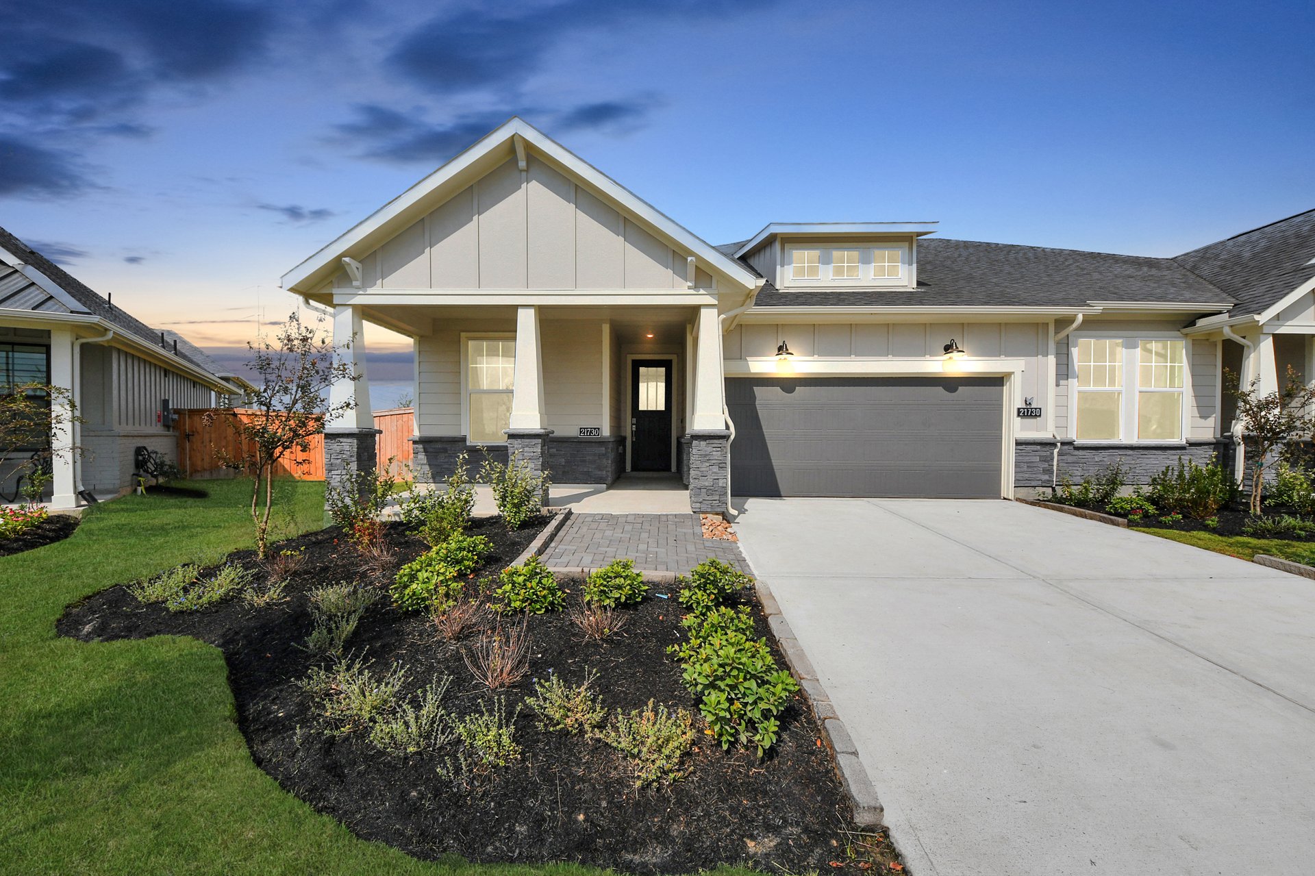 1-story with dark stone, light trim