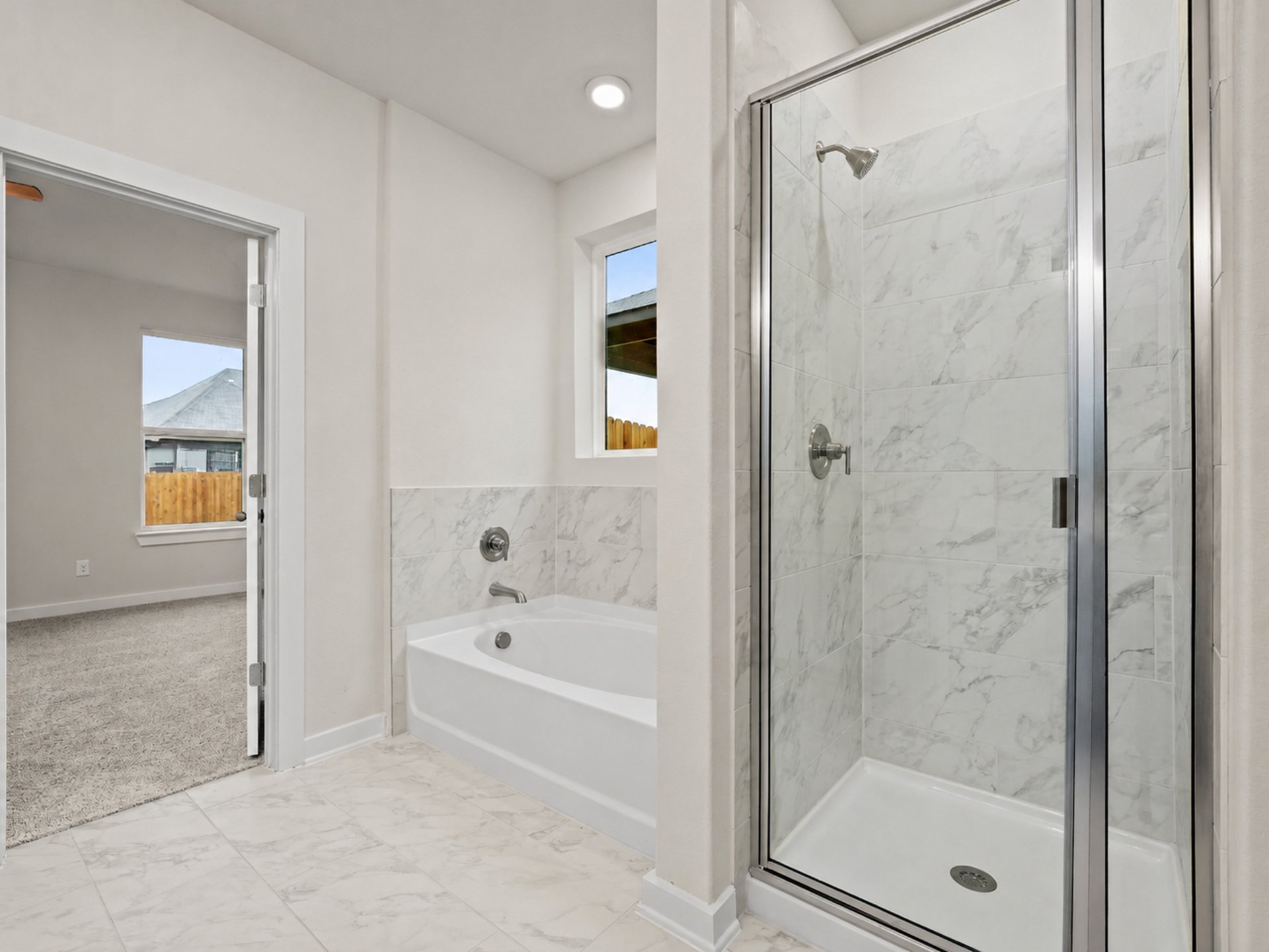 Primary bath with a soaking tub and walk-in shower