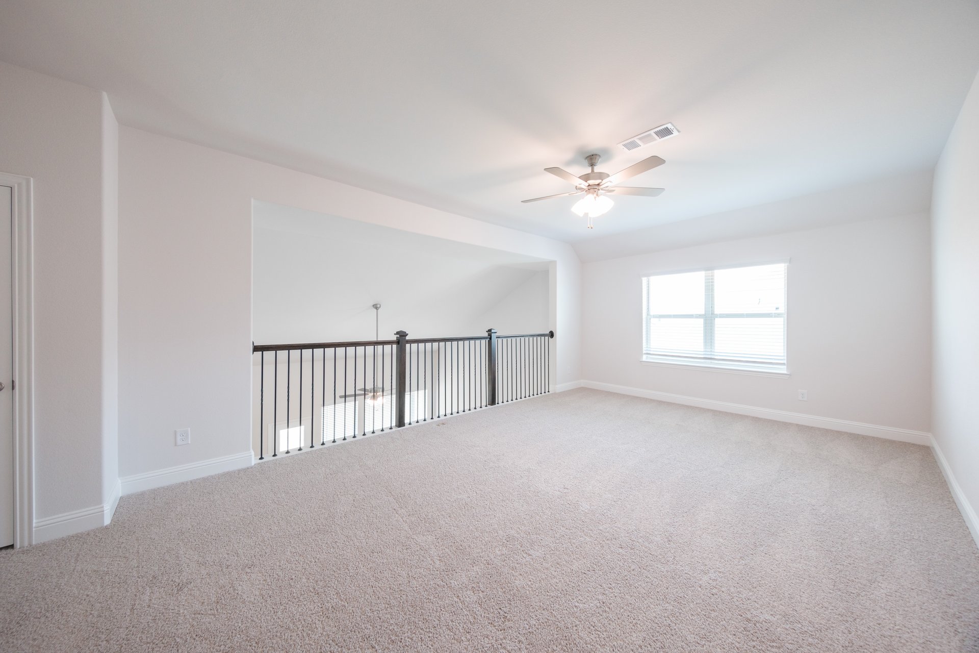 open gameroom with carpet and ceiling fan