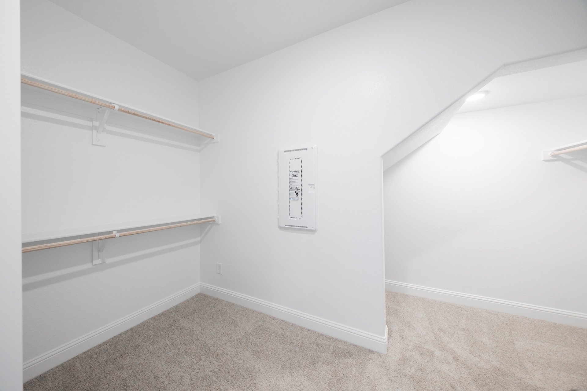 primary bedroom closet with carpet and white shelves
