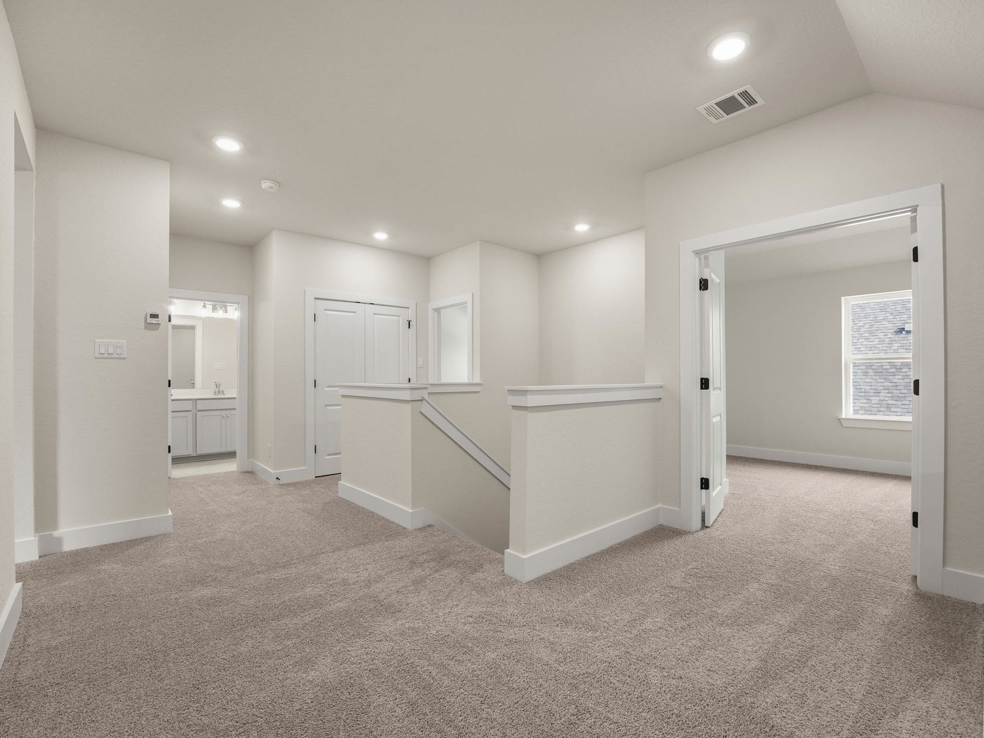 loft with carpet, sloped ceiling and stairs