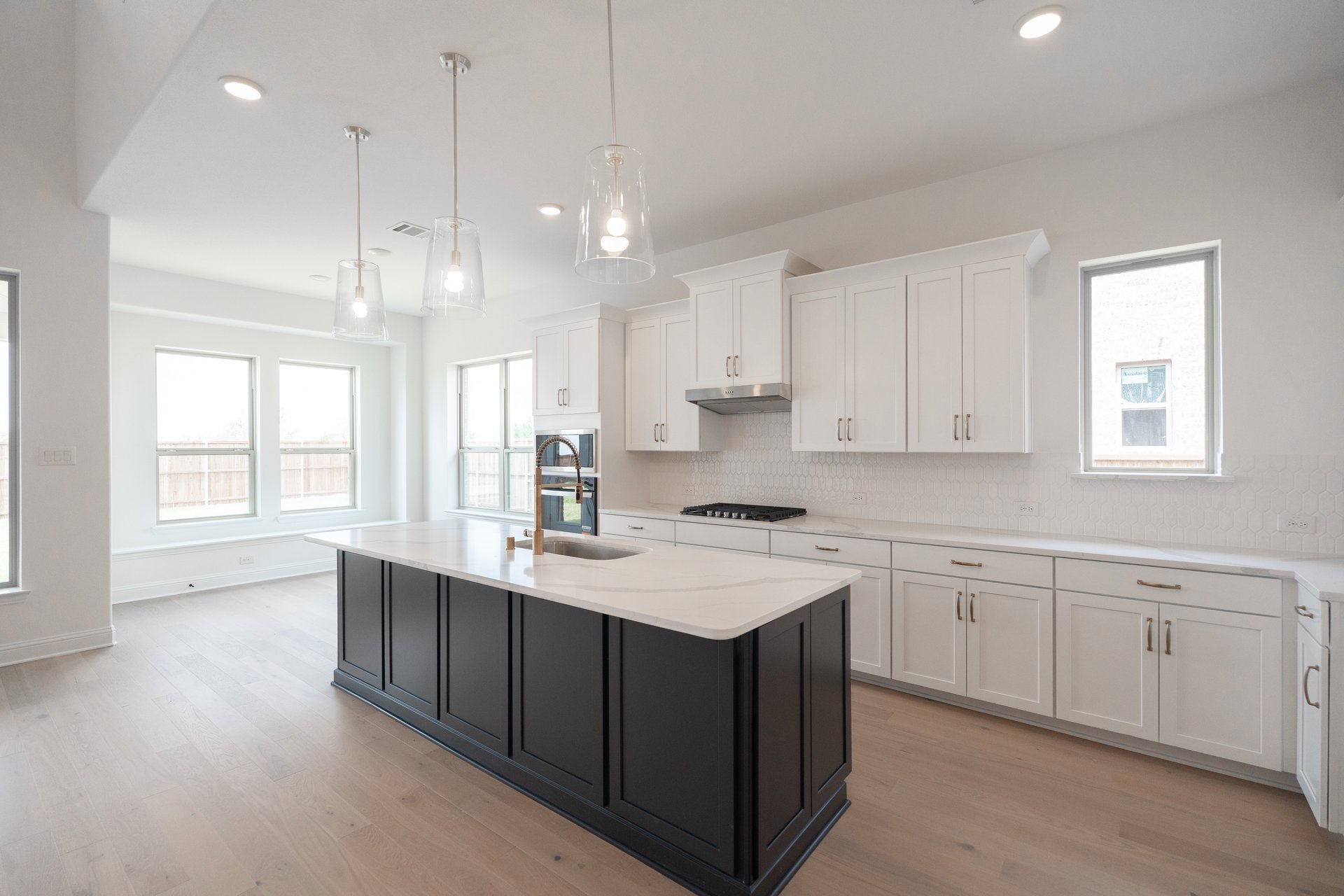 kitchen with large island and white cabinets 