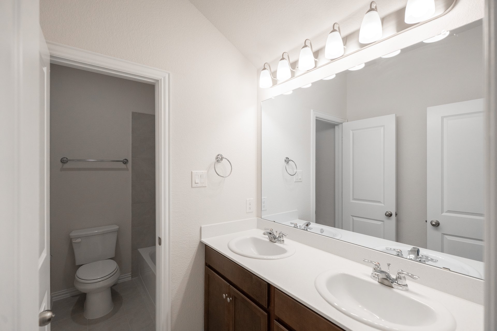 bathroom with two sinks and white countertops