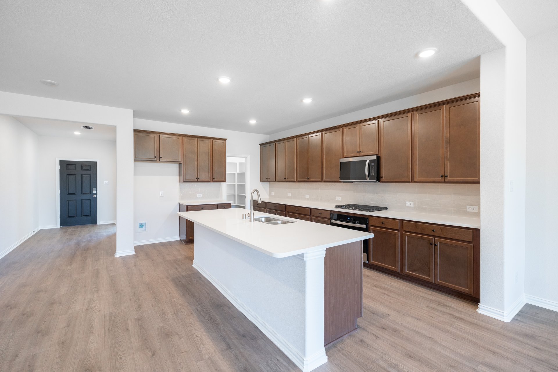 kitchen with large island and white countertops
