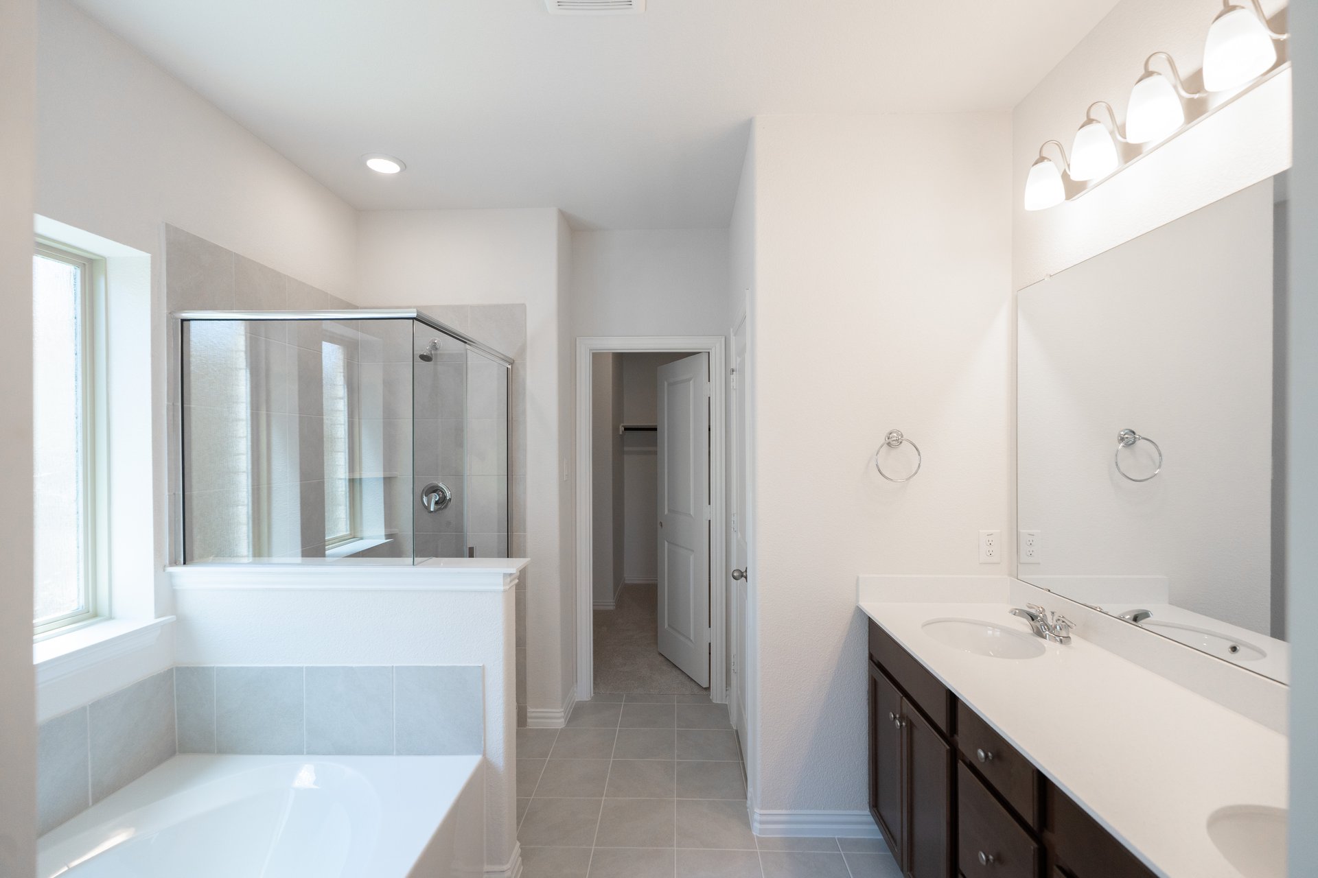 bathroom with tub and walk-in shower