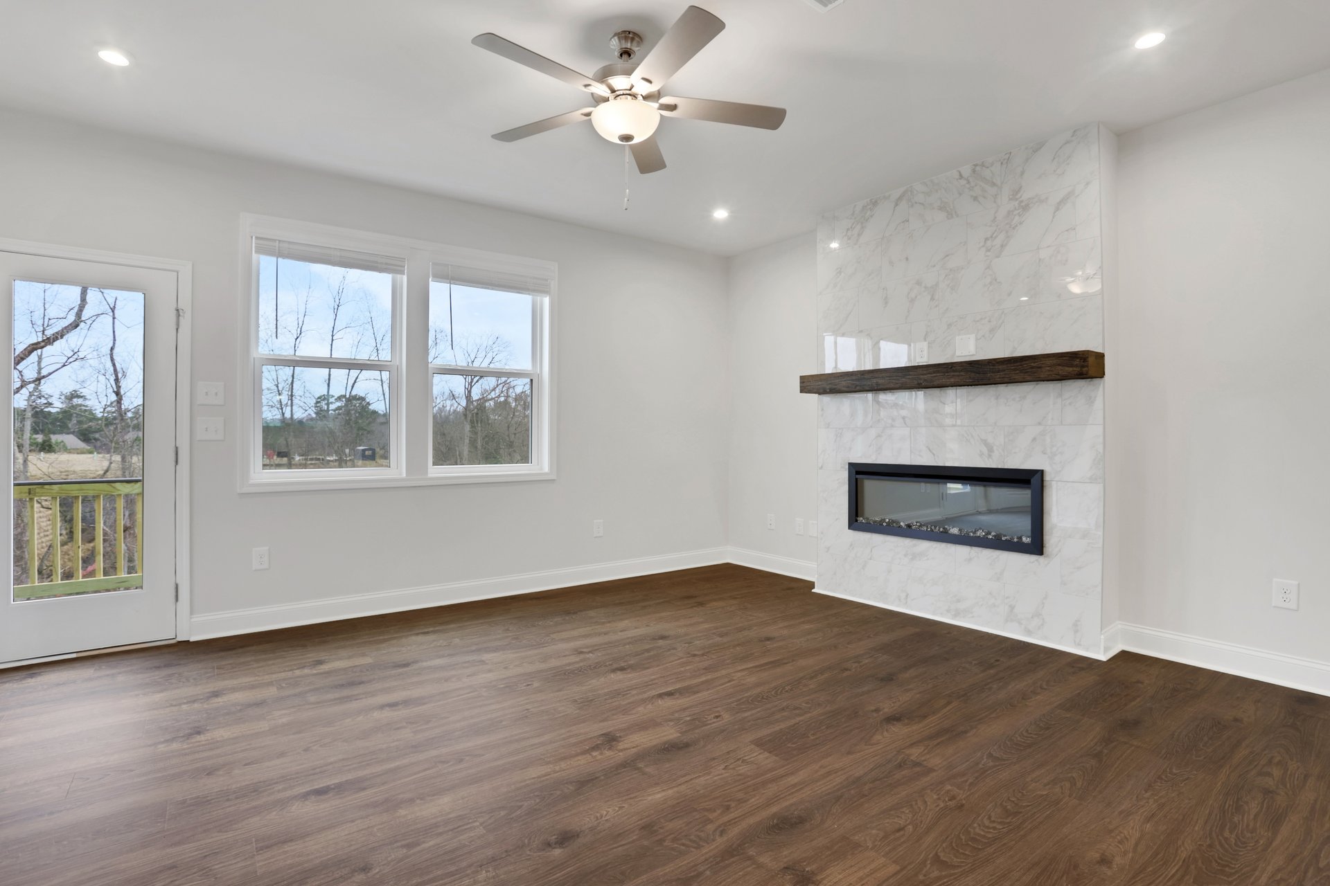 great room with electric fireplace and hard surface flooring