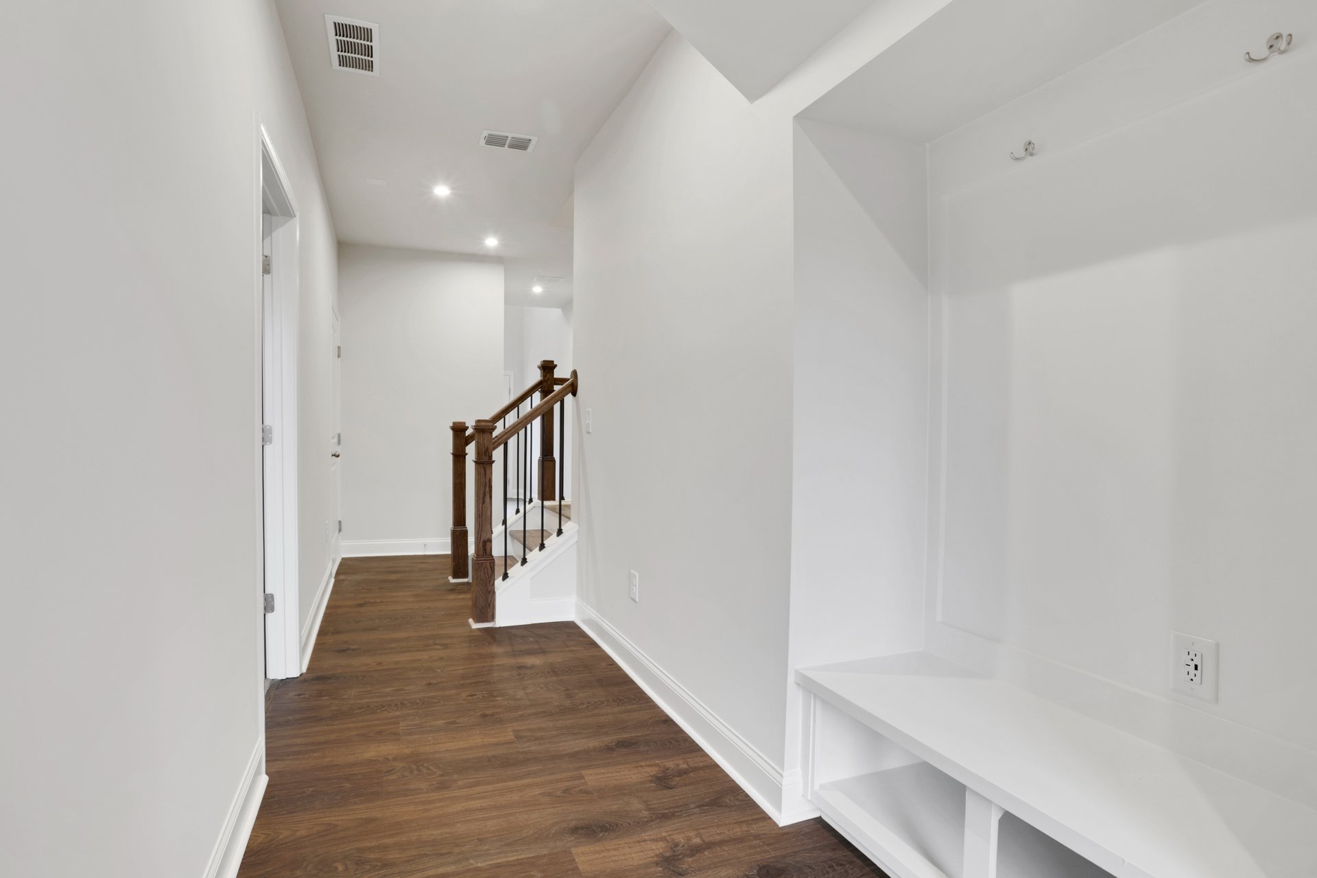 mudroom with hard surface flooring on first floor