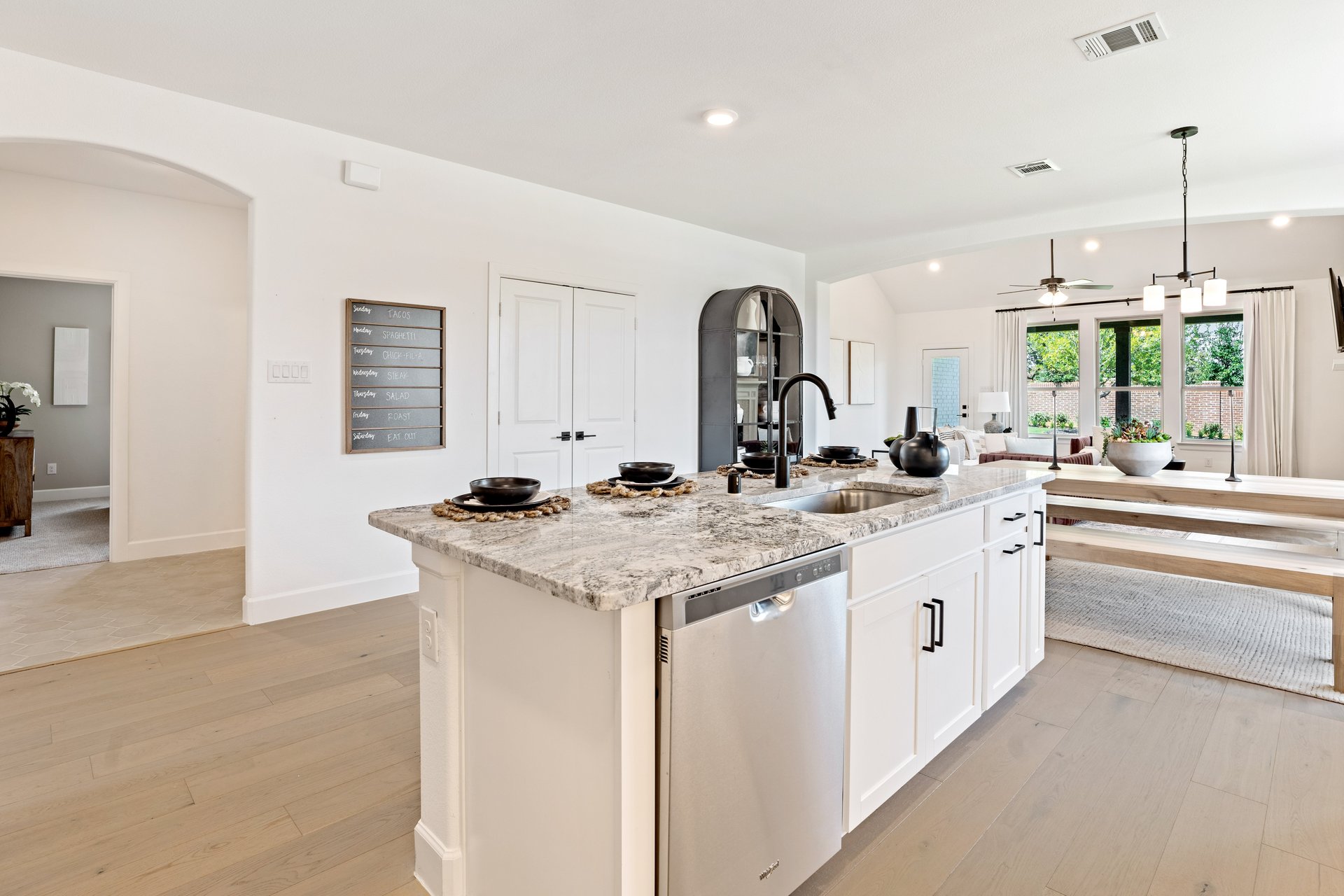 open kitchen with wood floors and large island