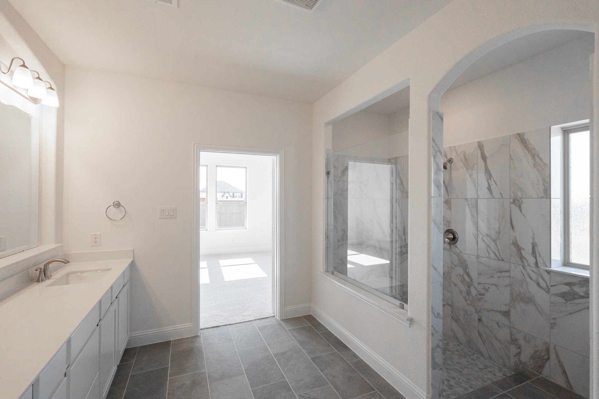 large primary bathroom with walk-in shower