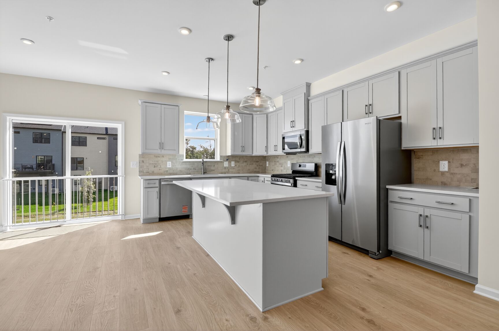 kitchen with gray cabinets and granite countertops