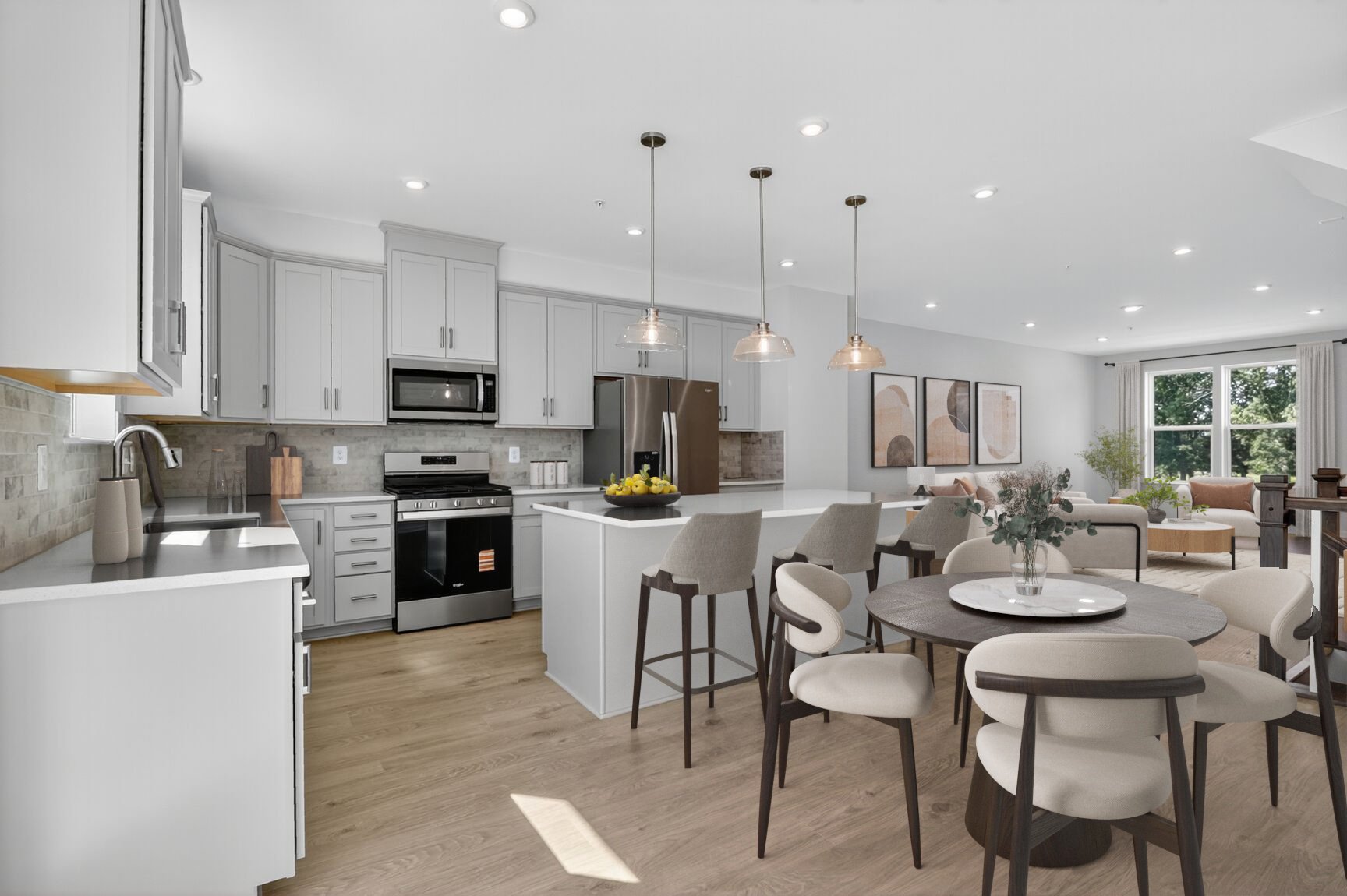 breakfast area with a table and chairs connecting to the kitchen