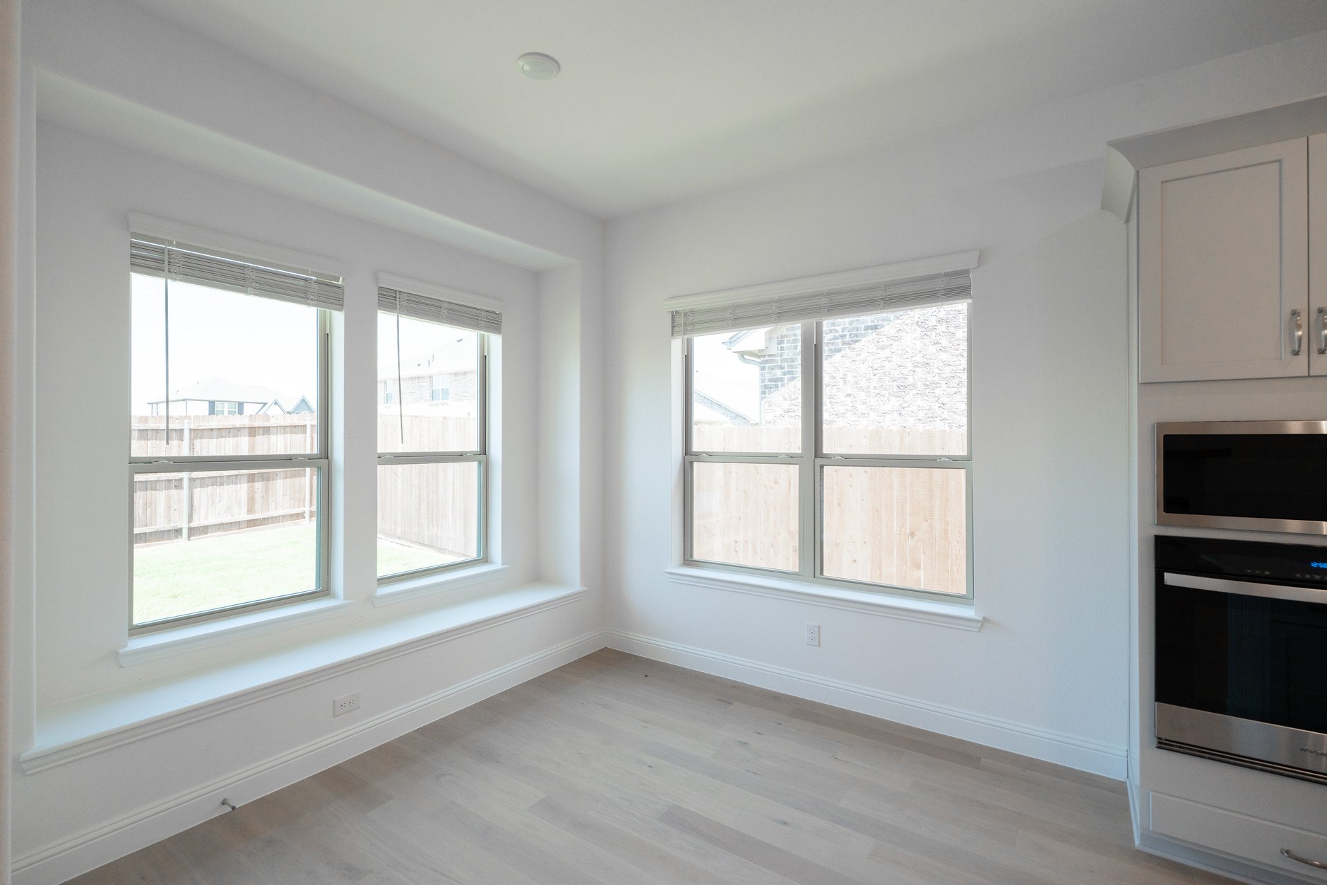 breakfast area with large windows and wood flooring