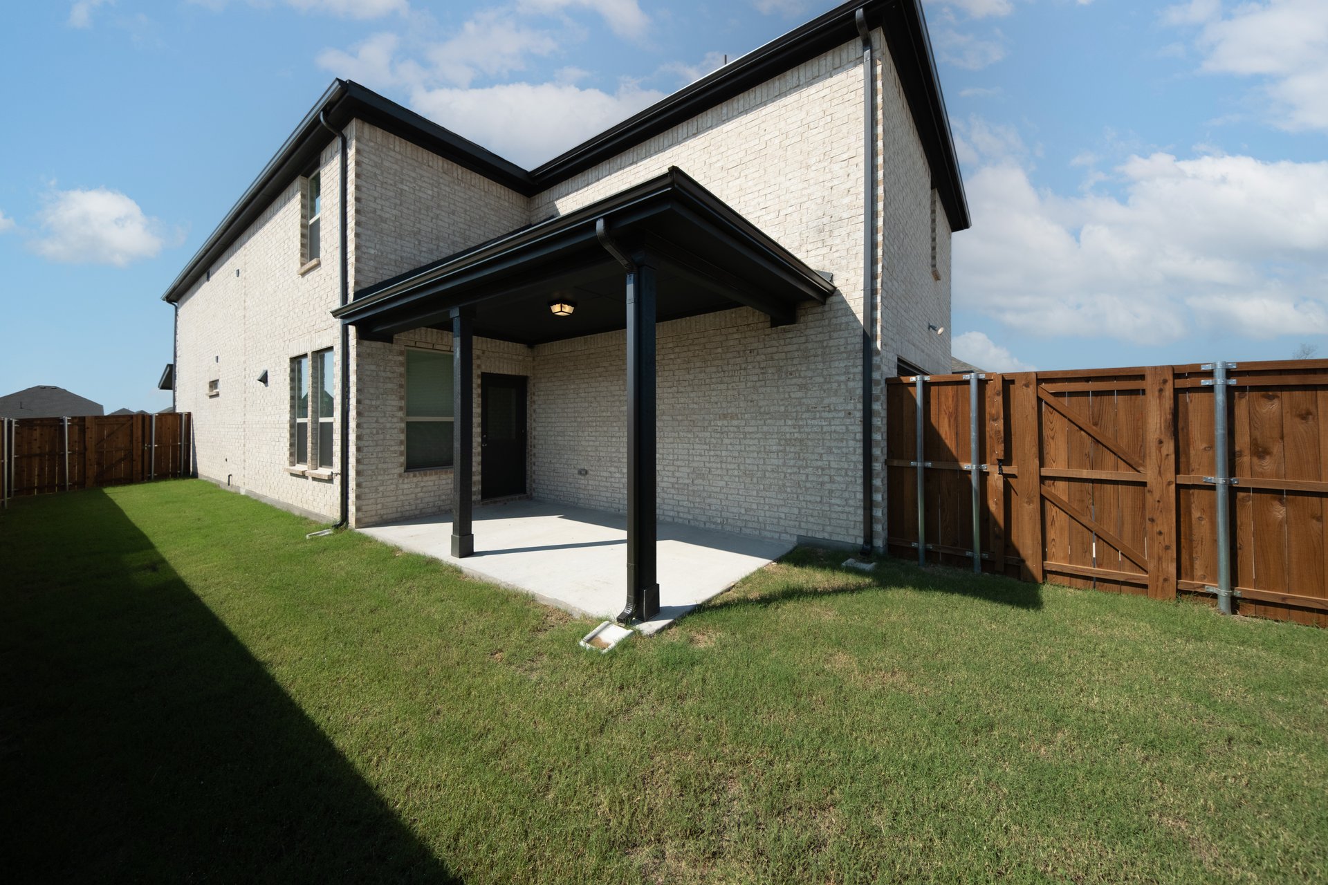 backyard of home with covered patio