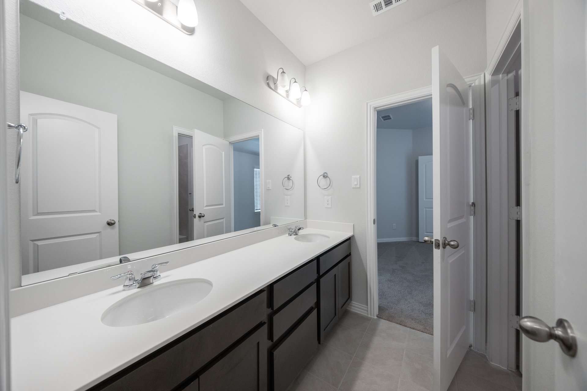guest bathroom with double sinks